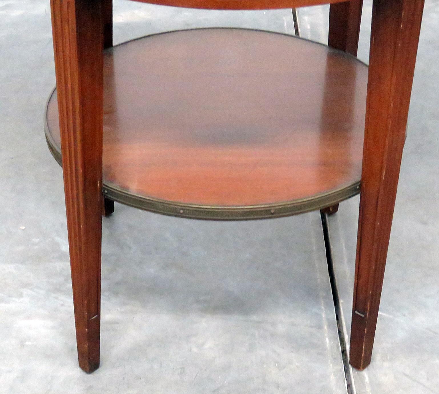 Regency style 1 drawer leather top bouillotte table with a brass gallery.