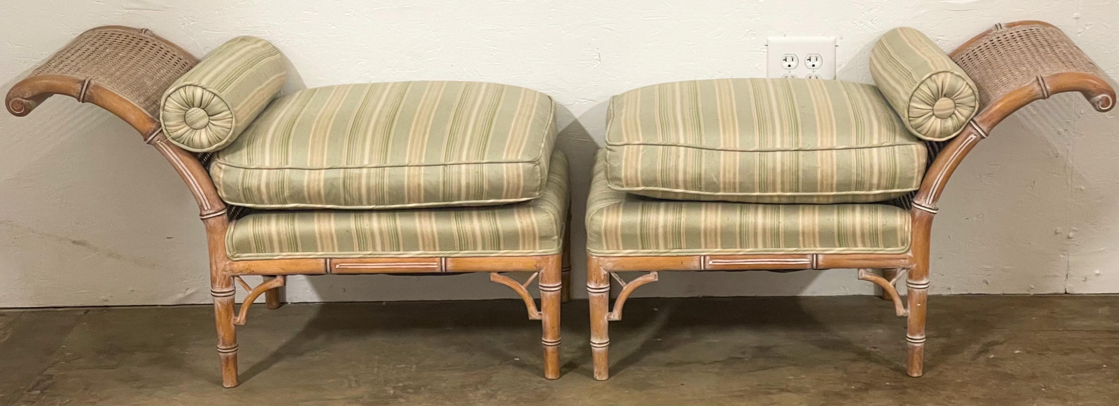 This is a wonderful Regency style lymed faux bamboo and cane bench or chaise. It is unmarked and in very good condition, but the silk upholstery is vintage. The bolsters have staining. The piece is 72” in total length.