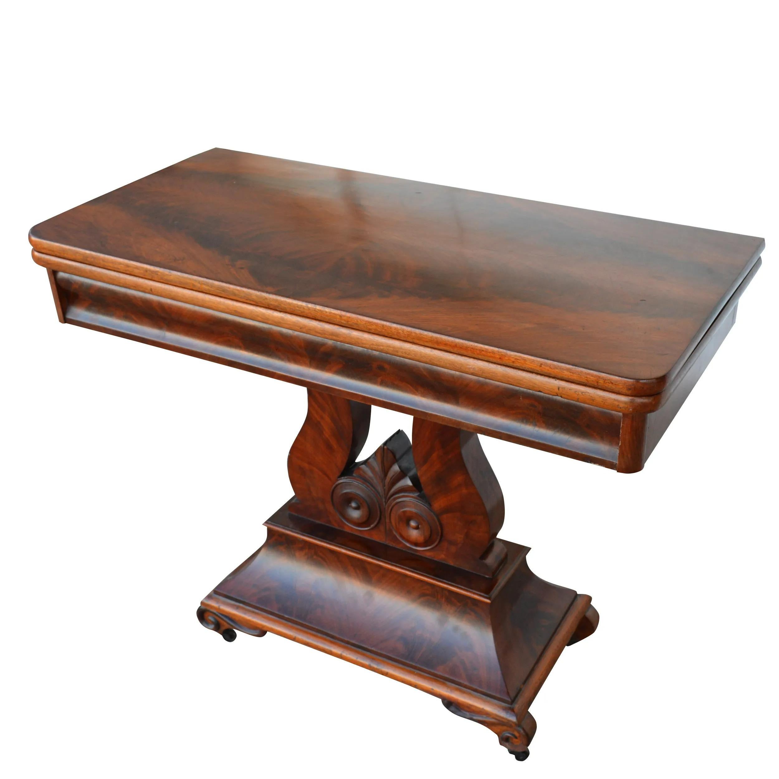 Regency style Mahogany Lyre base game table

Rich Flame mahogany on a stepped harp lyre base. When closed can serve as a console and open as a dining or gaming table. 

Measures 37