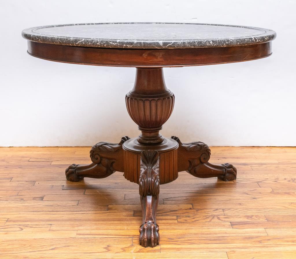 Regency style mahogany paw-foot pedestal table with 'gris de saint-anne' marble top with molded edge. 28