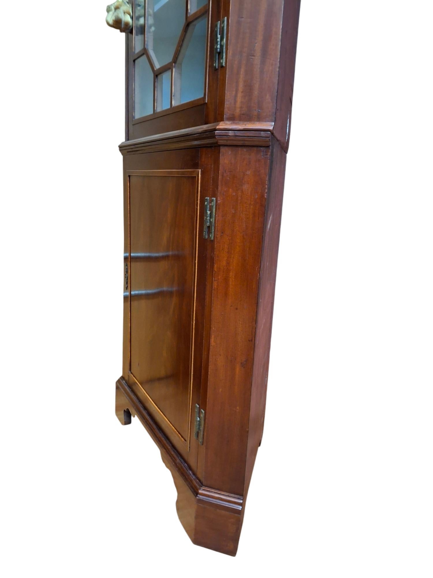 Regency style mahogany string inlay corner cabinet
