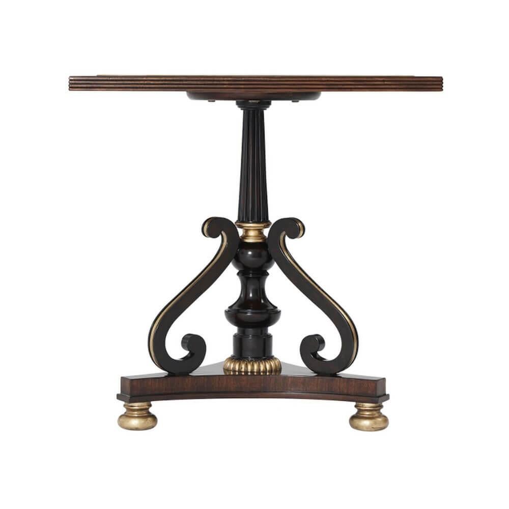Regency style carved mahogany, hand-leafed gilt accent table, the square reeded edge top inset with chequerboard specimen marble, on a reeded and baluster turned column with a gadrooned gilt base, issuing 'S' scroll supports, on a trefoil base
