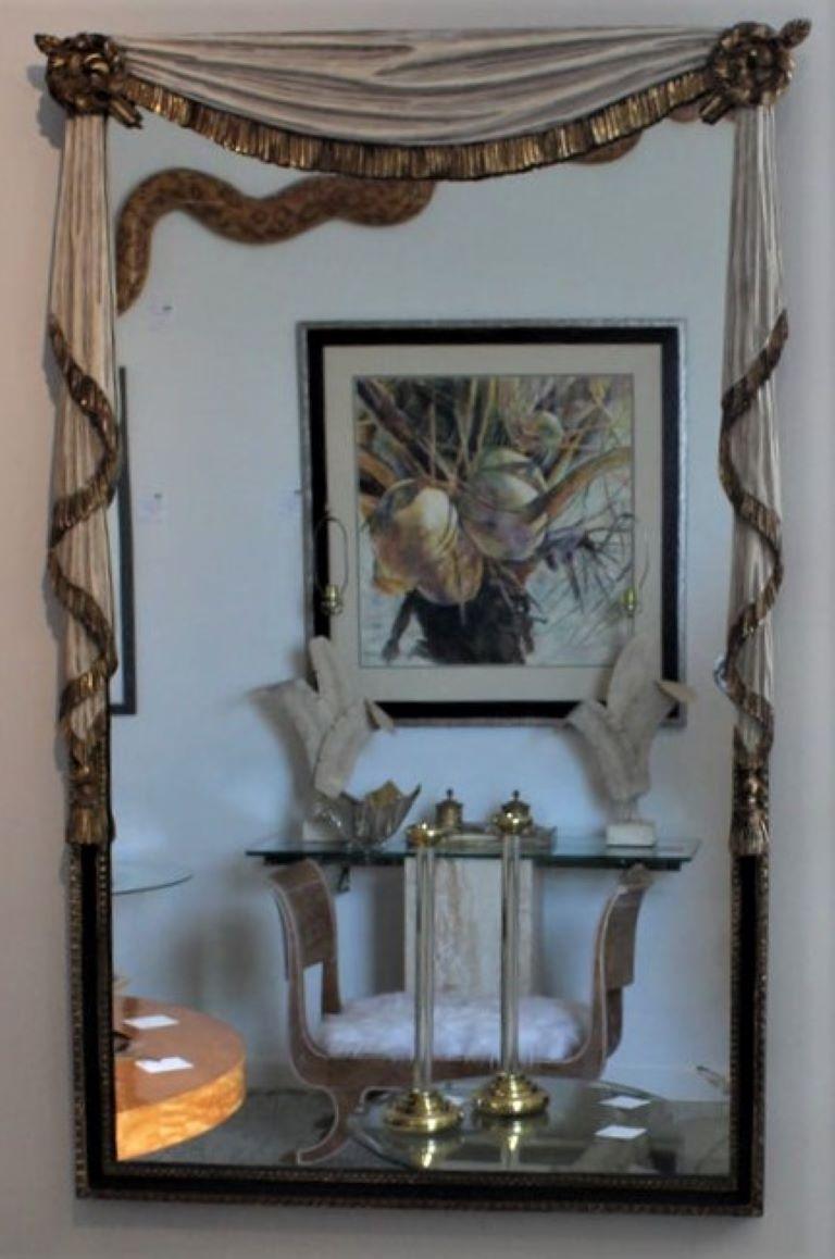 Elegant vintage Regency style wall mirror with gold ormolu and carved draperies - from a Palm Beach estate.
