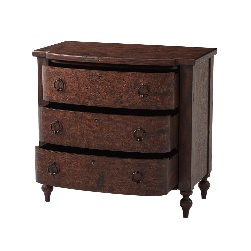 A Regency style reclaimed oak veneered and mahogany nightstand with D form drawer faces, a shaped top, and four finely turned legs supporting bold pilasters, with oil rubbed escutcheons and pulls on every drawer.

Dimensions: 34