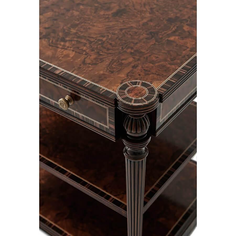 A fine Regency-style three-tier Nightstand with a crossbanded walnut burl top, sycamore and ebonized stringing details, single frieze drawer, with reeded and tapered legs on a plinth shelf base.

Dimensions: 28