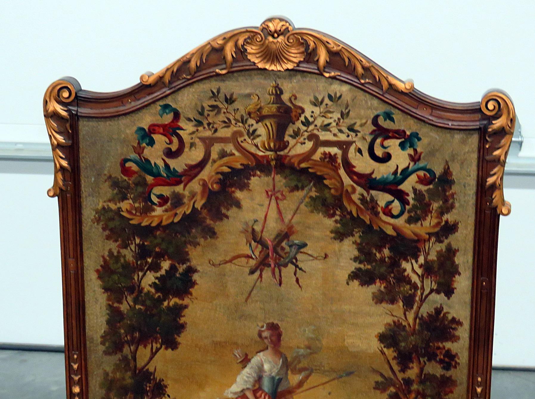 Regency style oil panted screen in a wooden frame with gilt accents.
