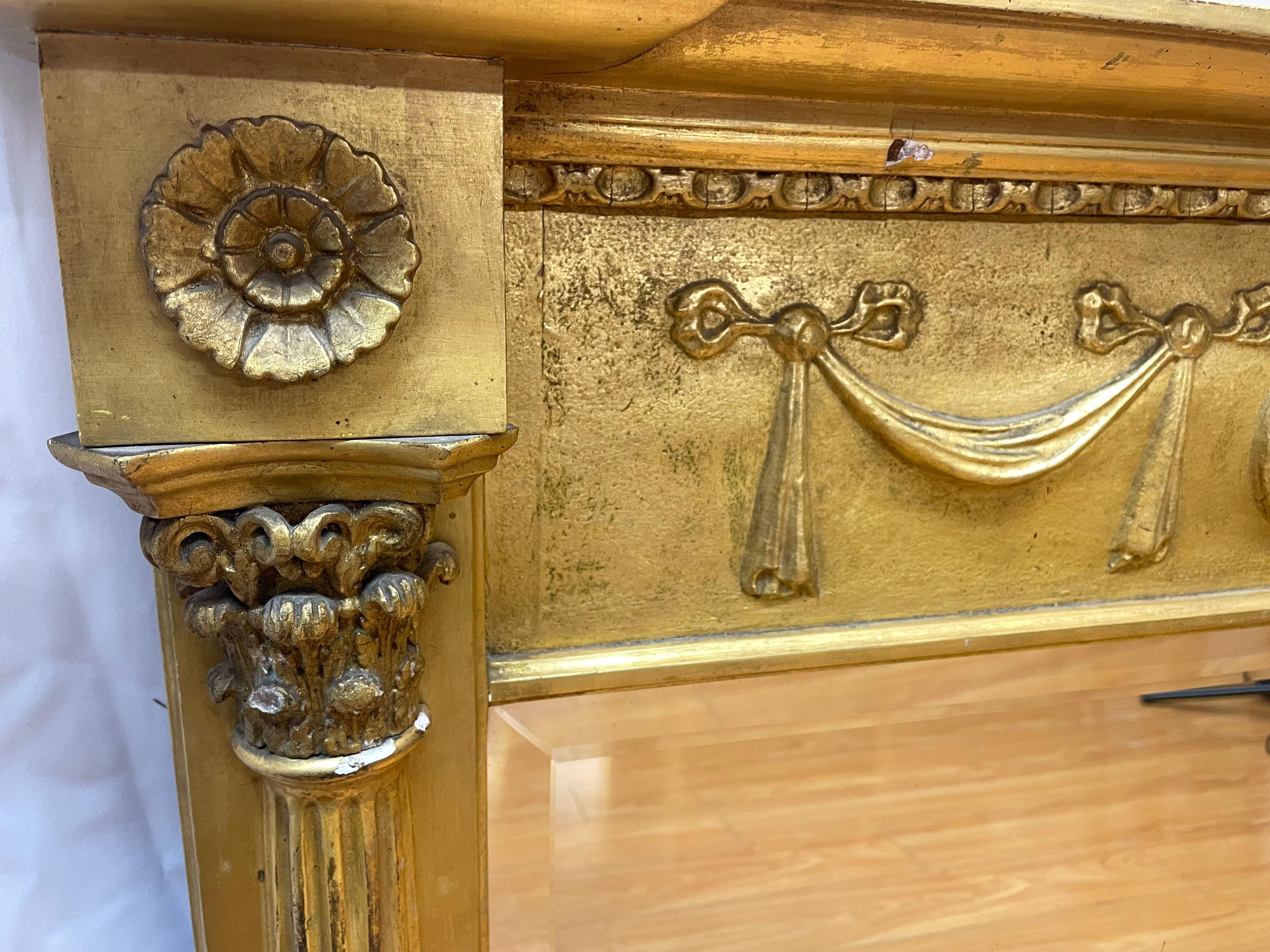 Miroir de cheminée de style Régence, doré avec motif de ruban

Du début au milieu du 20e siècle

51x55x33