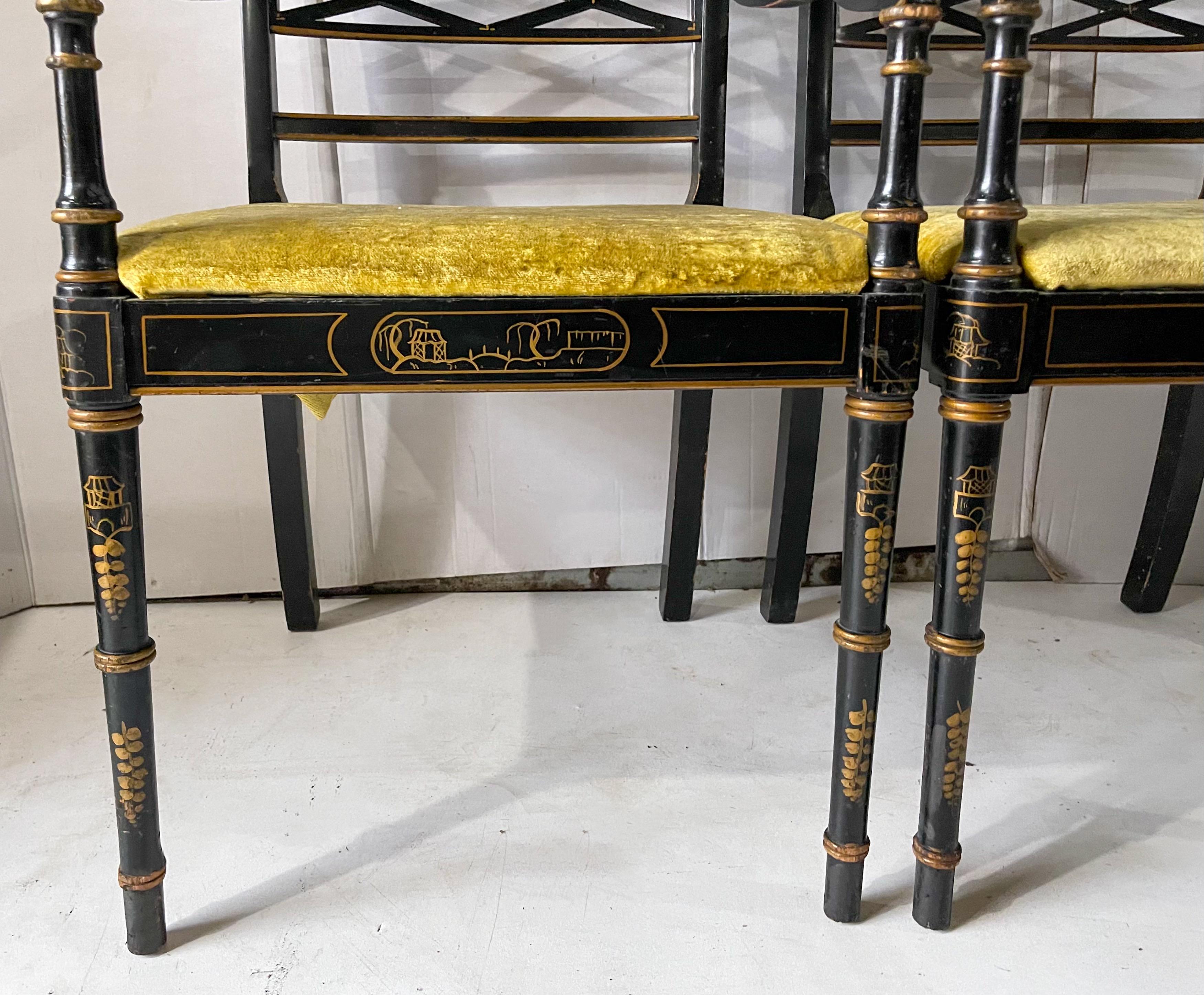 These lovely chairs have regency styling with chinoiserie and floral details throughout the black lacquer frame. They most likely date to the 1950s, and the velvet upholstery does show wear. They are unmarked.