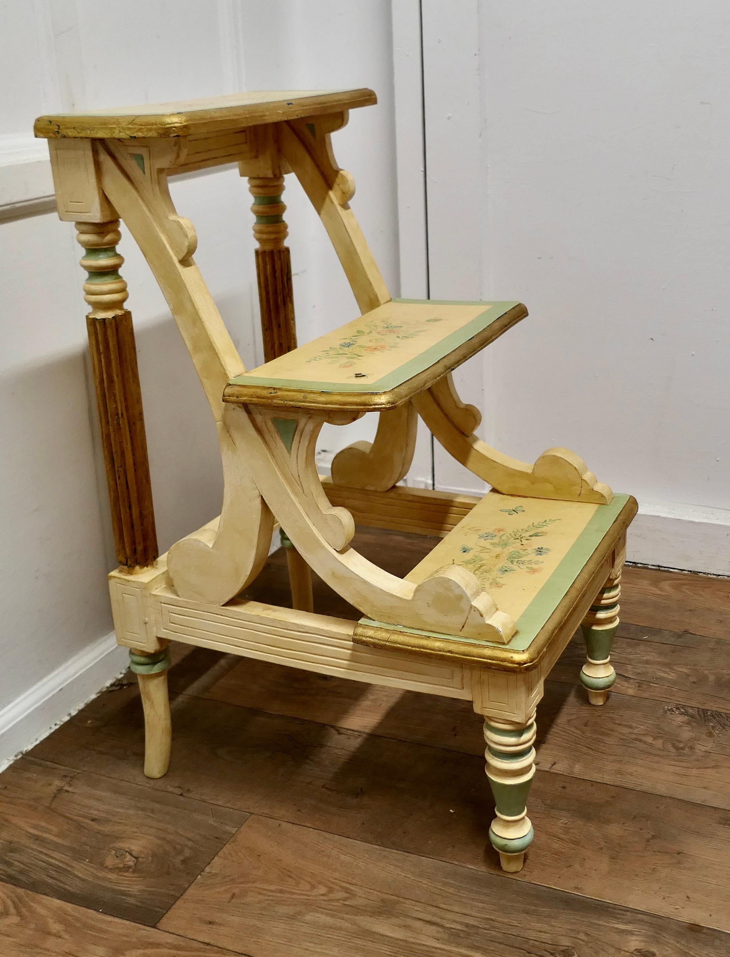 Regency Style Painted Library Steps
 
This is a sturdy solid piece there are 3 steps, the ladder is pointed in the Regency style in Cream, Green and Gold with pretty floral detail with bees and butterflies
The ladder would make a superb useful and