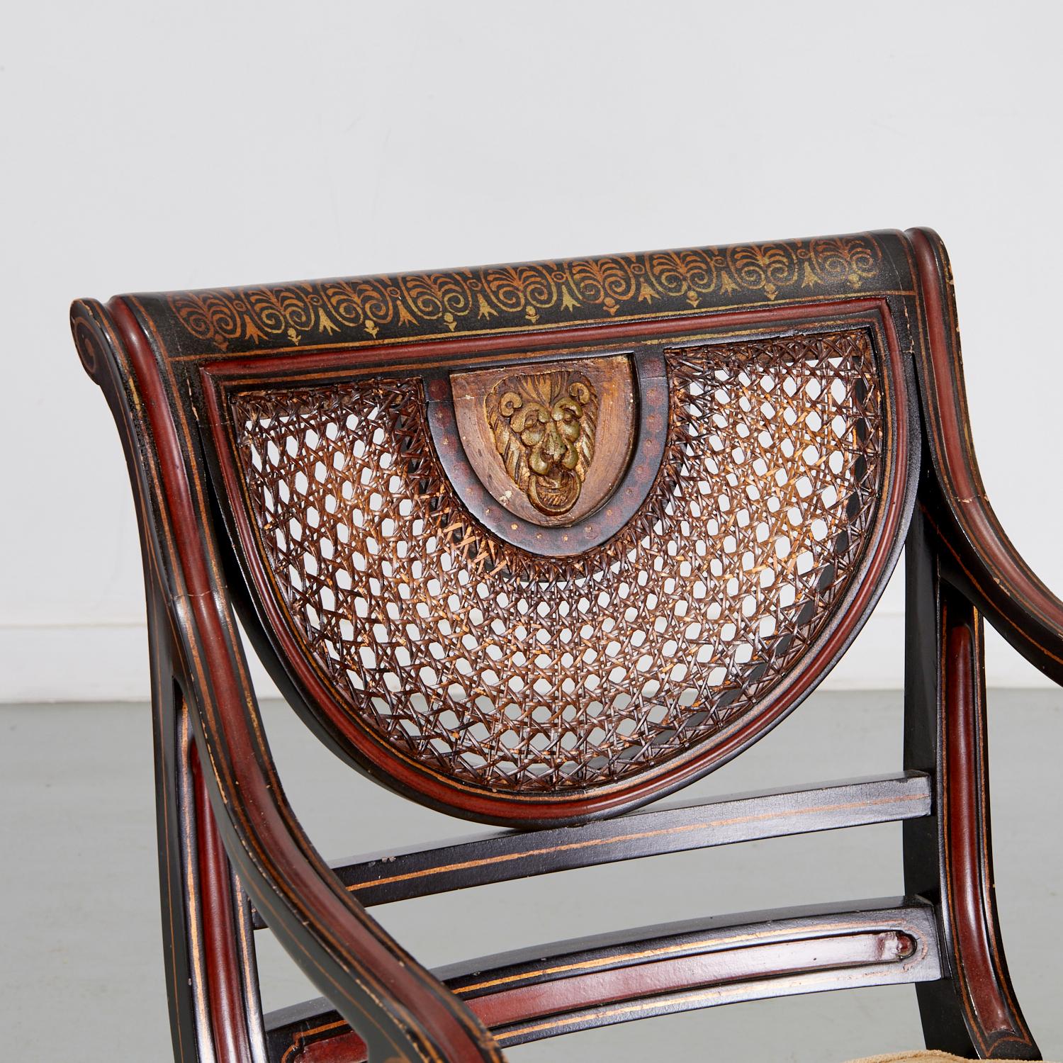 Regency Fauteuil de style Régence en bois d'ébène avec assise en rotin, dossier avec détails en tête de lion en vente