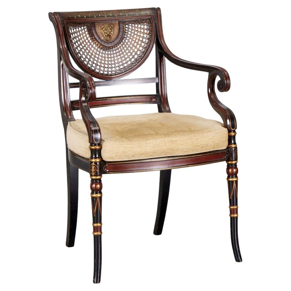 Regency Style Parcel Ebonized Armchair with Cane Seat, Back with Lionhead Detail For Sale