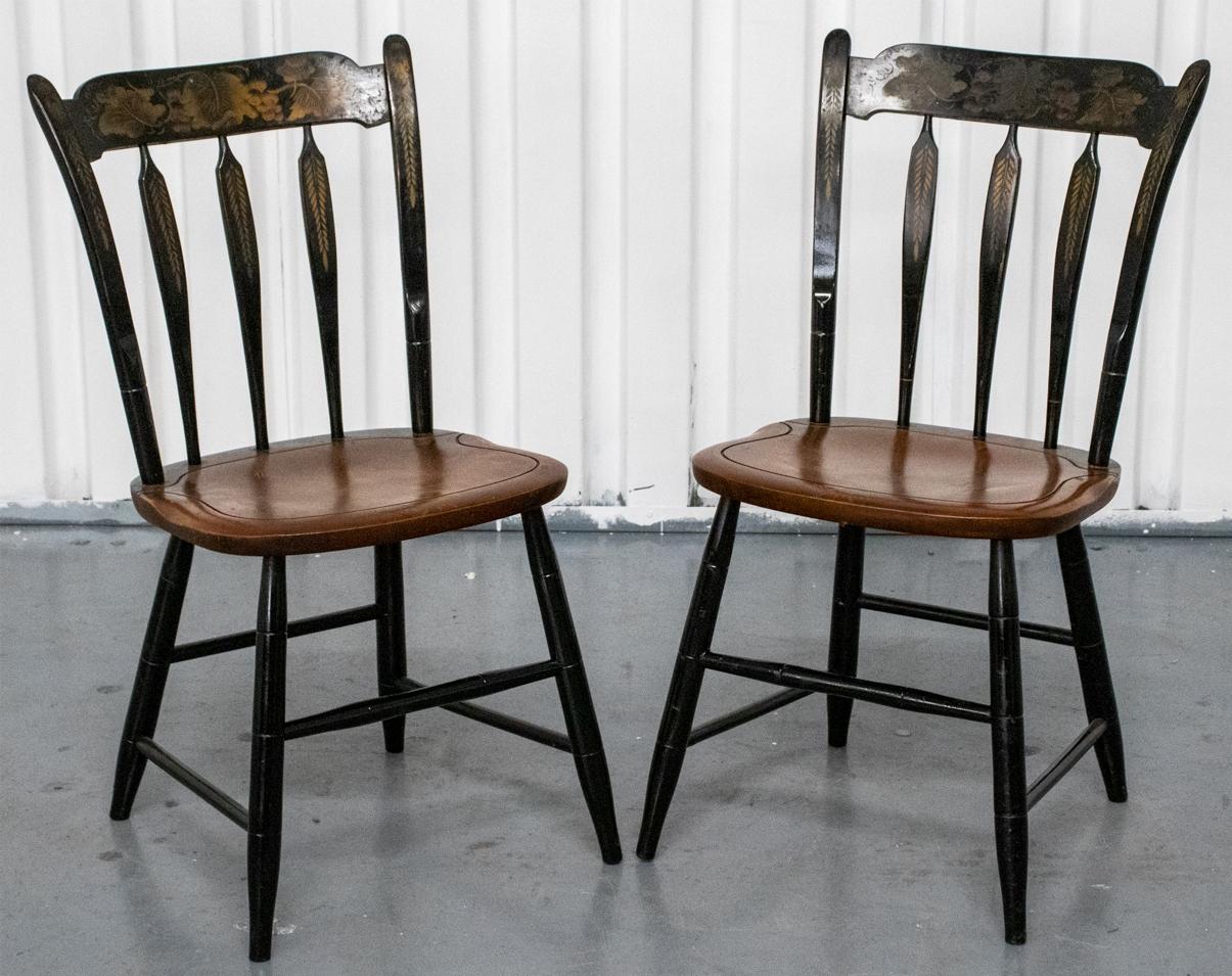 Regency style parcel ebonized paint decorated chairs, 20th century, the four side chairs with foliate motifs throughout over parcel ebonized frames.

Dealer: S138XX