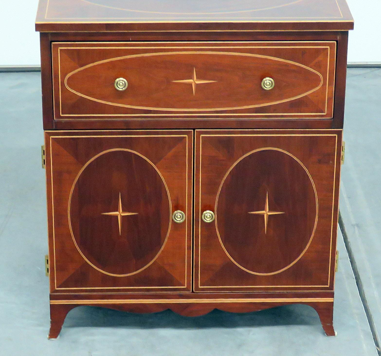 Regency style paint decorated commode with 1 door over 2 drawers.