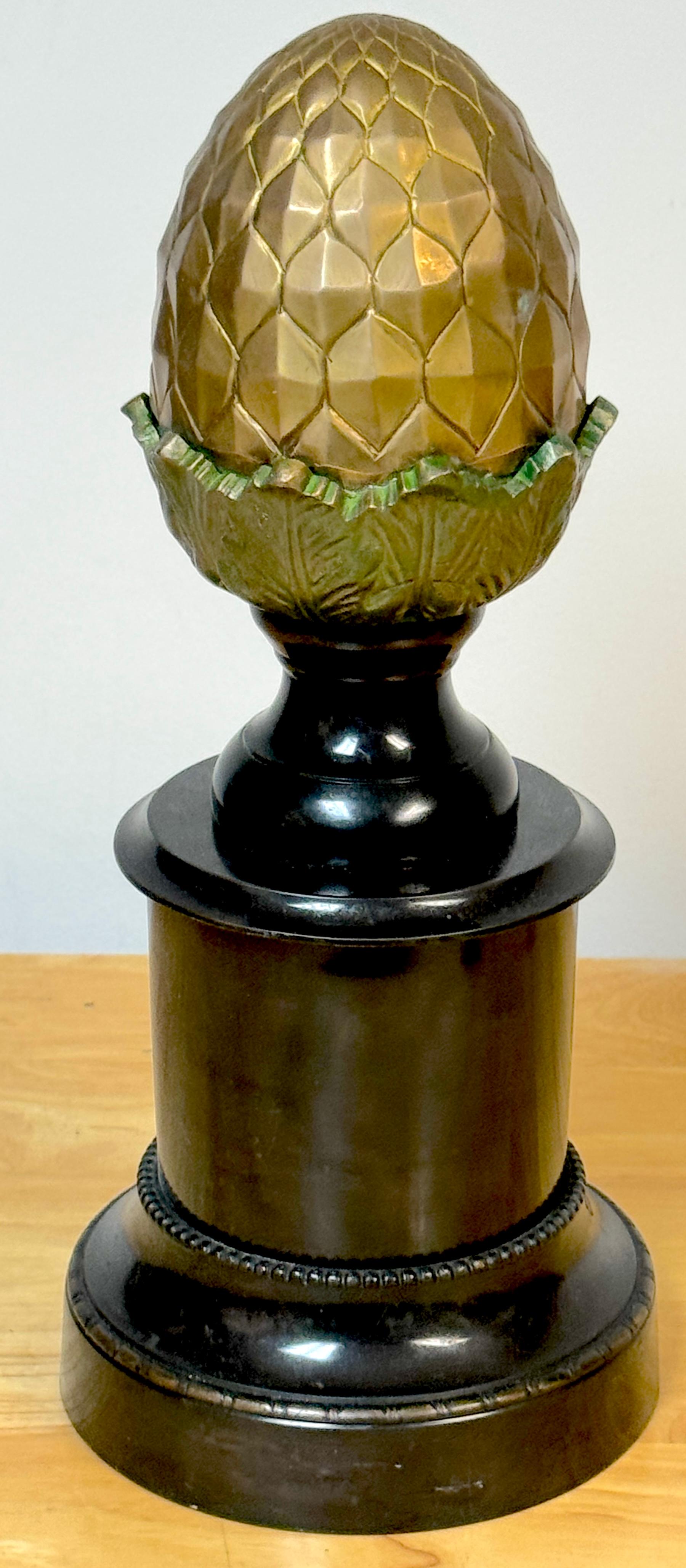 Regency-style polychromed bronze acorn motif newel post
England, 20th century 

A striking Regency-style polychromed bronze acorn motif newel post, made in England in the 20th century. This exquisite piece stands 16 inches high with a diameter of