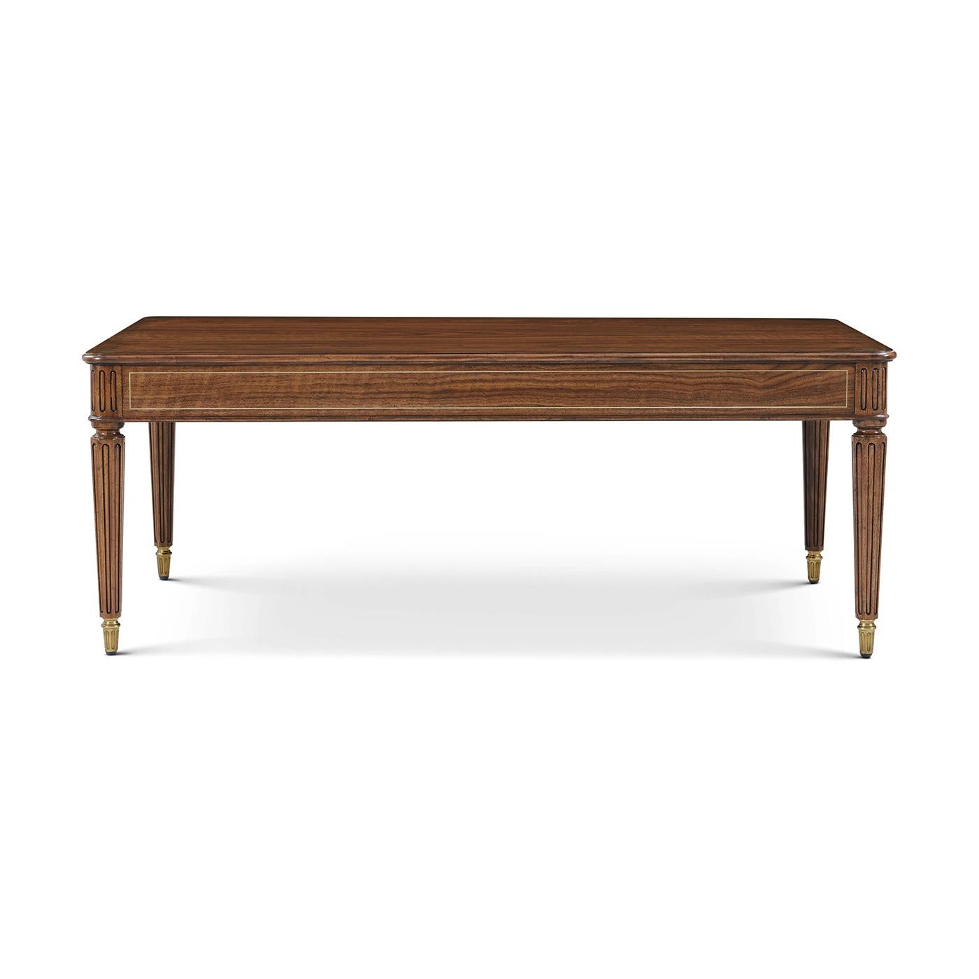Bring classical sophistication and architectural grace to the heart of any living space. Crafted in a warm walnut finish, its generously scaled top is accented with fine brass inlays, adding a subtle gleam to the richly figured wood grain.

Tapered,