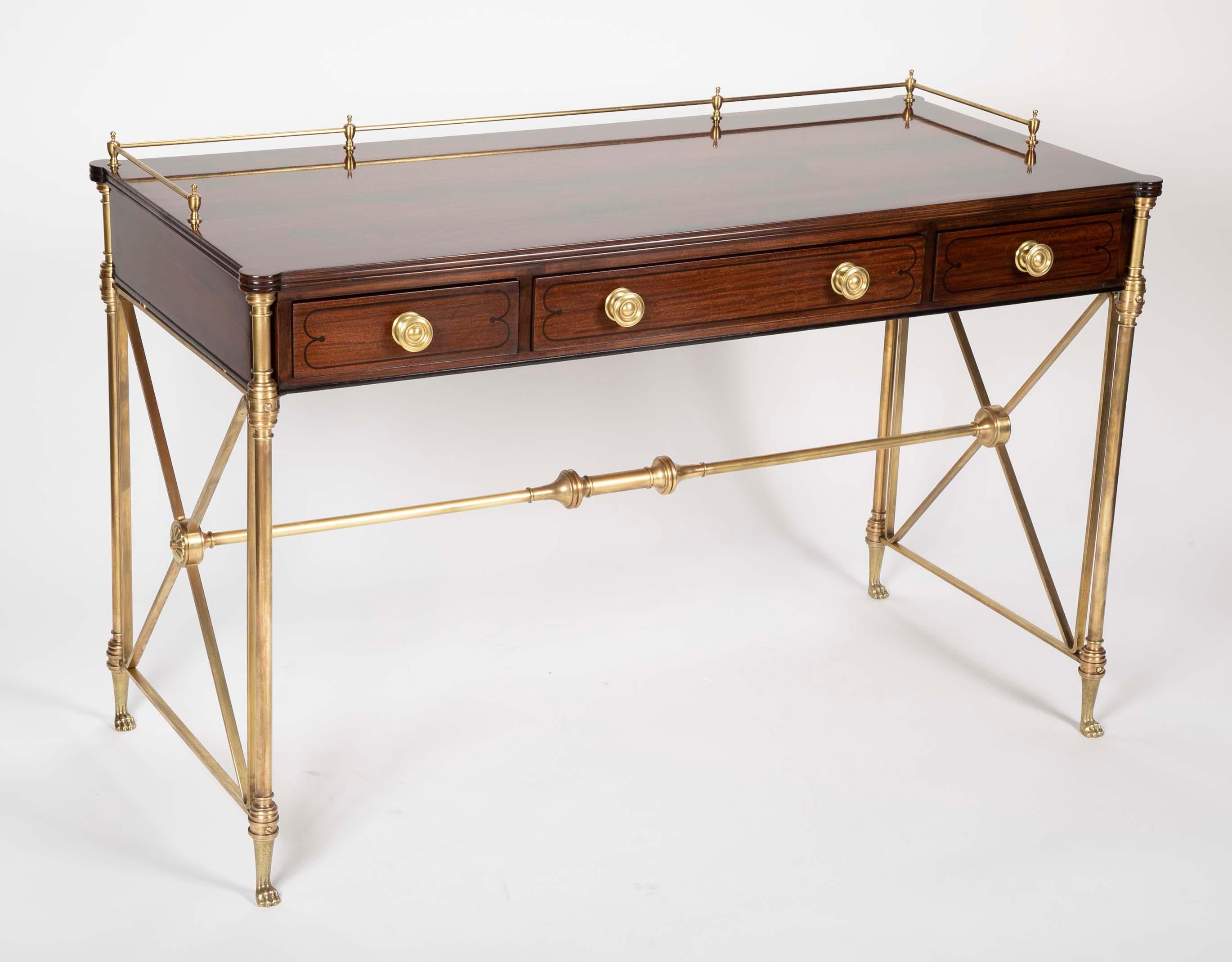 Classic rosewood Campaign desk in the English Regency style. With bronze legs and stretcher and paw feet. This handsome, beautifully designed desk is the height of elegance. Perfect as a writing table, desk or console table. Midcentury, made by