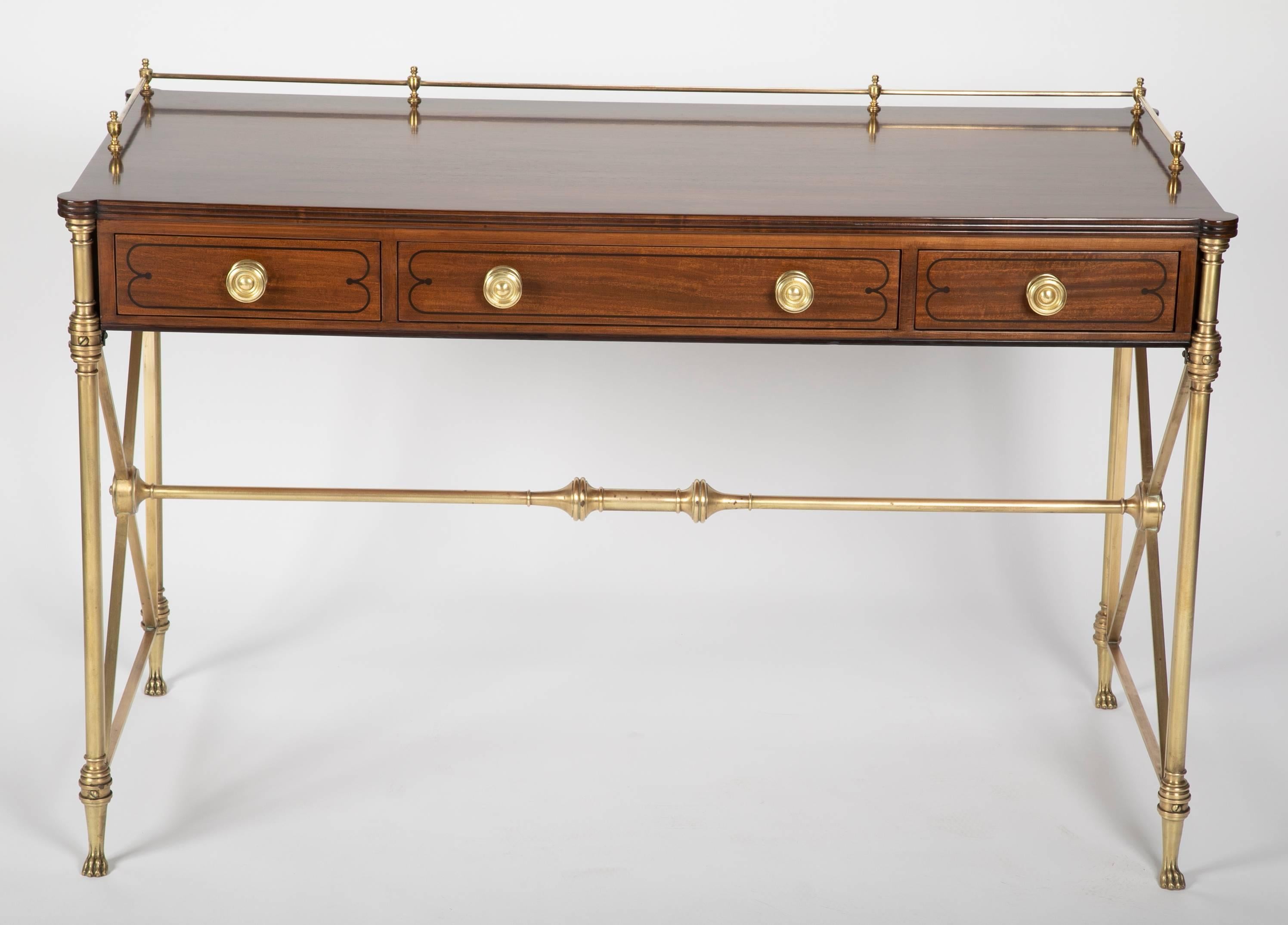 Classic rosewood Campaign desk in the English Regency style. With bronze legs and stretcher, the legs ending in paw feet, X form stretchers at the sides. This handsome, beautifully designed desk is simply elegant, echoing neoclassical design.