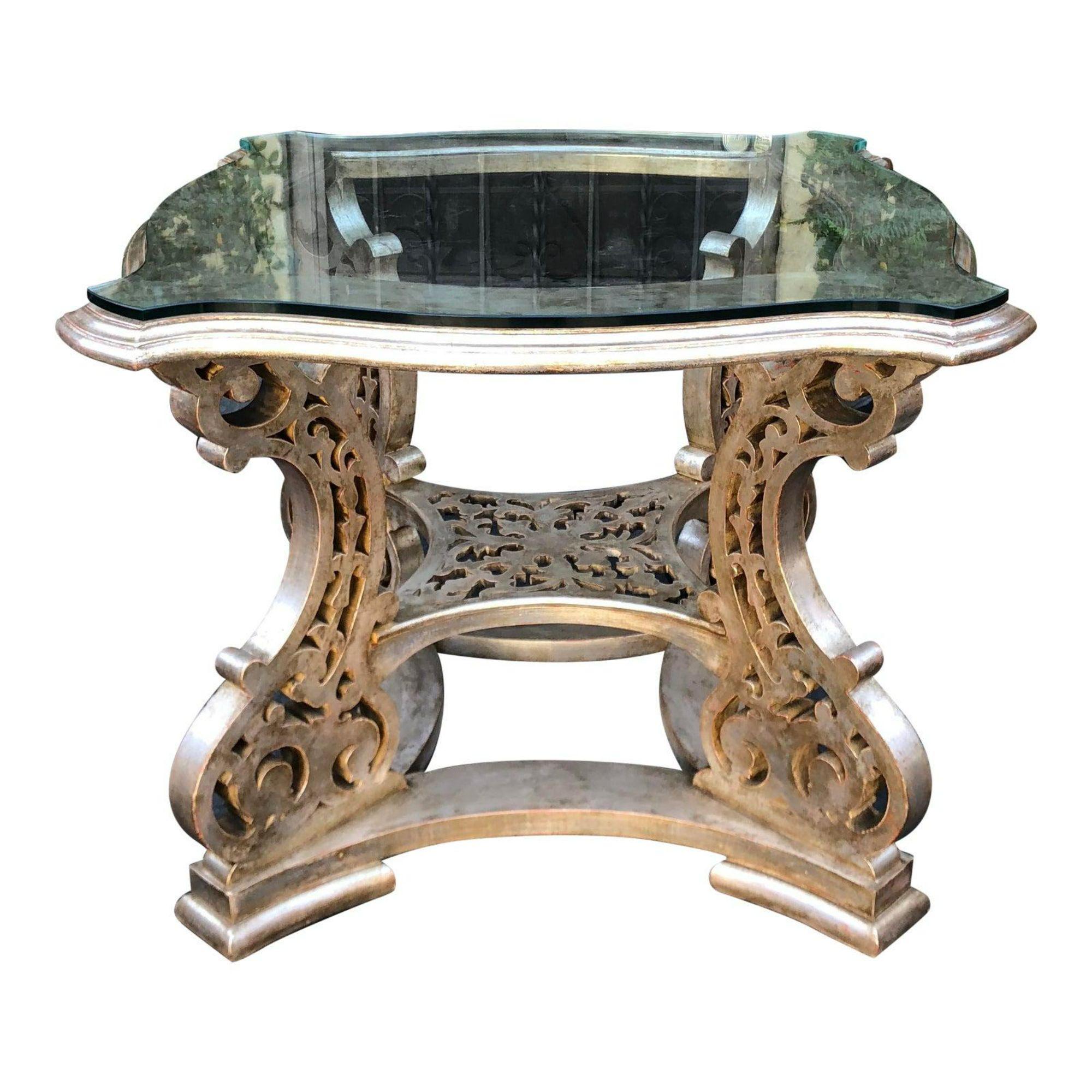 Regency Style silver silver giltwood designer center table.

Additional information: 
Materials: Giltwood, Silver
Color: Silver
Period: Early 20th century.
Place of Origin: North America
Styles: Regency
Table Shape: Other (unique