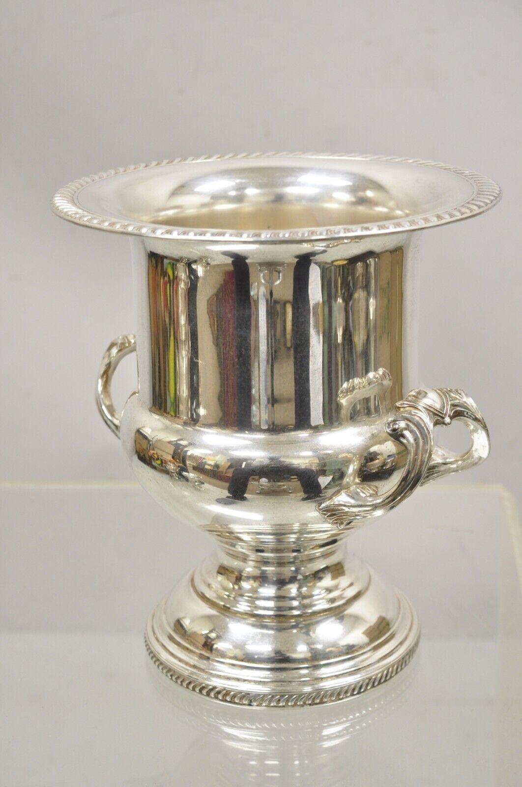 Regency Style Silver Plated Twin Handle Champagne Wine Chiller Ice Bucket. Item features ornate twin handles, decorated rim, great style and form. Circa Mid to Late 20th Century. Measurements: 10