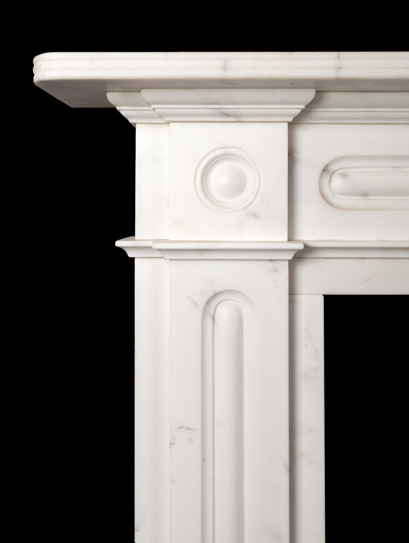 A late Regency style fireplace made from Italian Statuary Carrara marble. handcrafted in our Northern Irish workshop from imported Italian Statuary Carrara marble, faithfully copied from a Regency period piece.