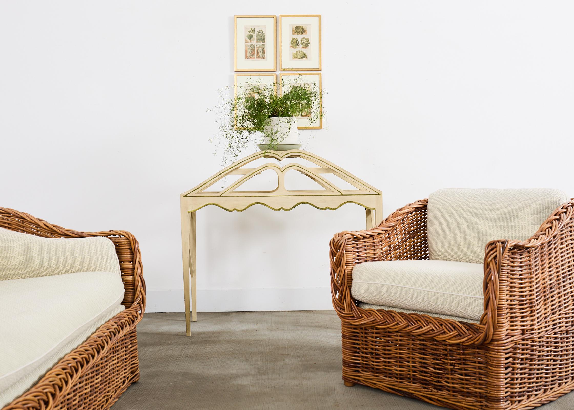 Graceful and elegant tiered plant stand designed by Niermann Weeks. The stand features five tiered steps or shelves for display conjoined by sinuous curved side rails with a decorative scalloped apron. The stand is supported by x form stretchers and