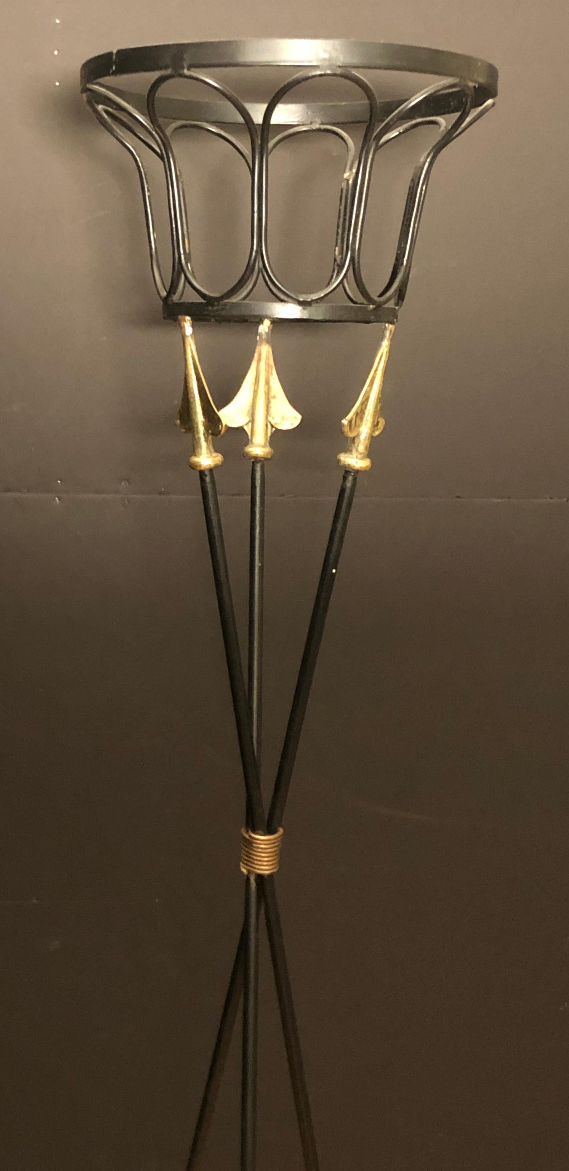 Iron and brass stylized neoclassical style torchère plant stand.
13