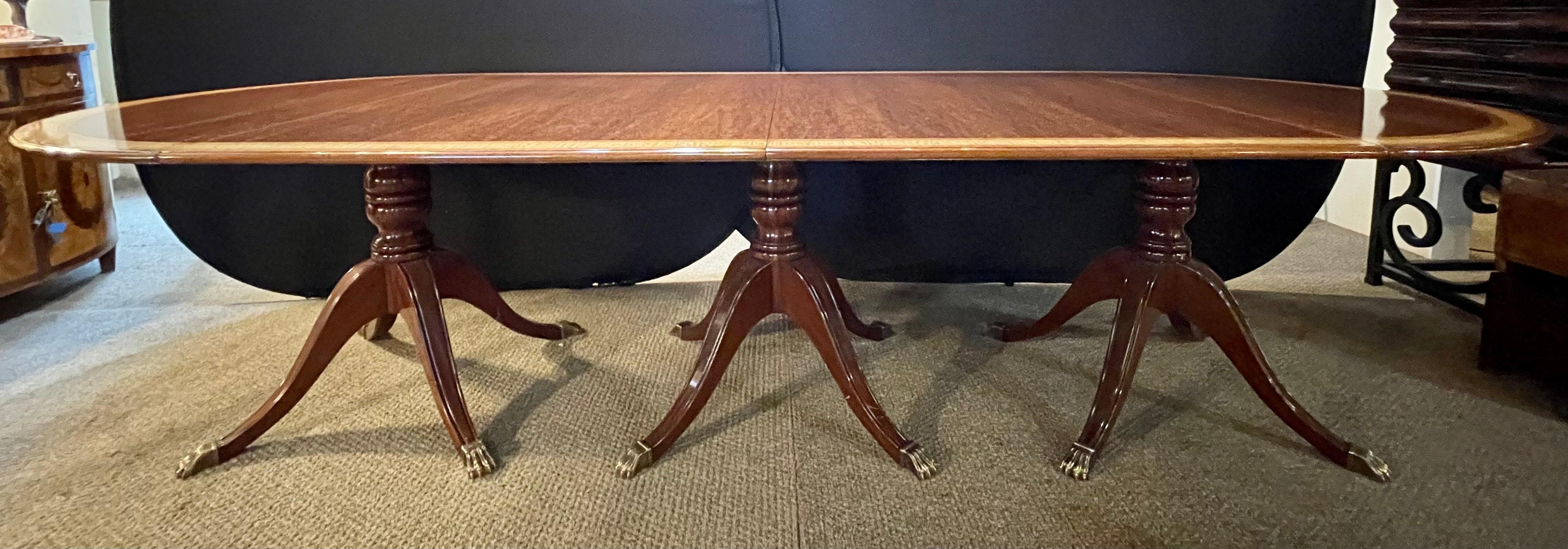 Regency Style Triple Pedestal Dining Room Table Banded and Fully Refinished In Good Condition In Stamford, CT