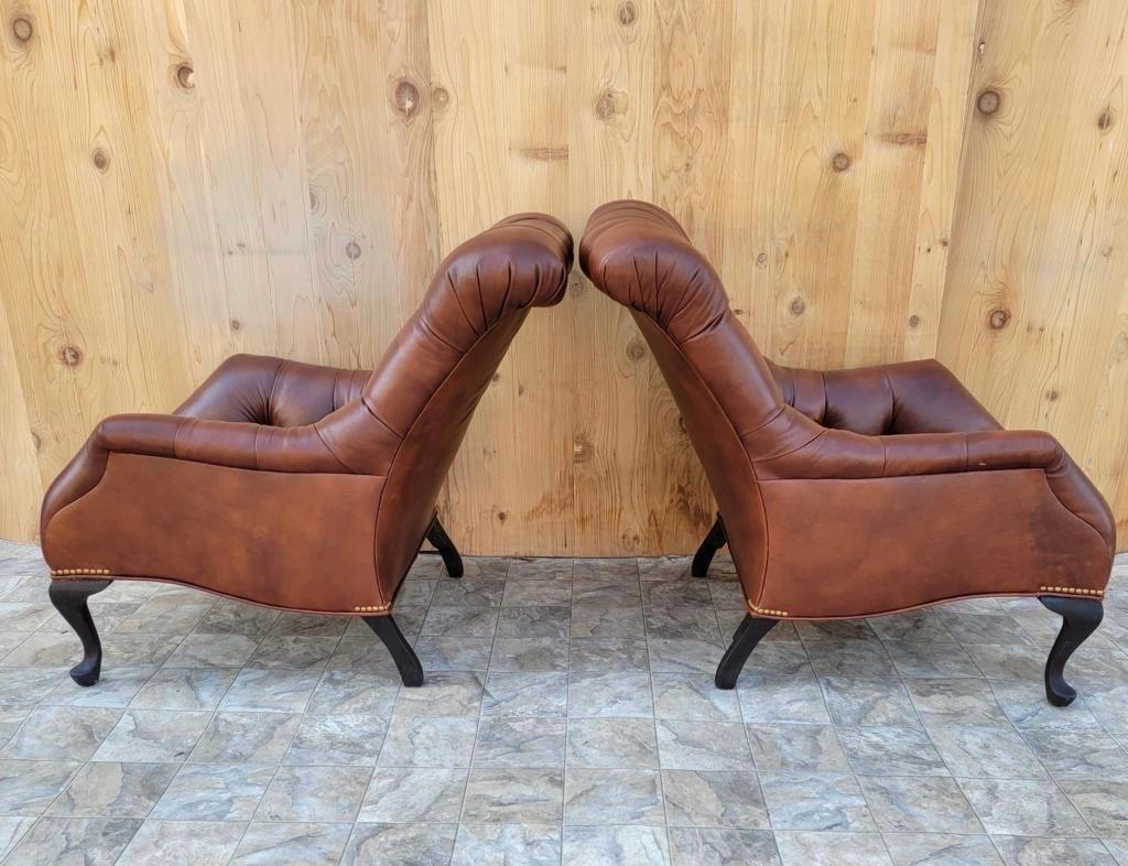 Vintage Regency style tufted sleepy hollow fireside lounge chairs newly upholstered in a high end whiskey leather - pair 

Light a candle, grab a book and settle in for a while! Introducing regency style, arched back, tufted lounge chairs. These