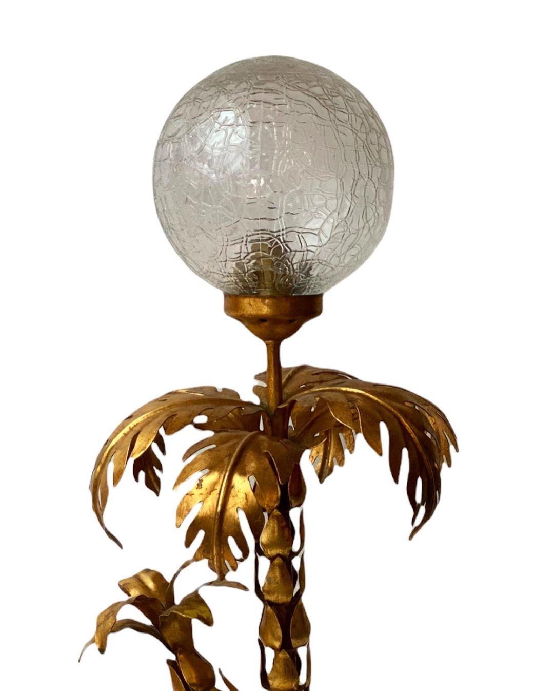 A Nature-inspired graceful luminary. The Palm Tree Table Lamp by Hans Kögel draws up heavily from the natural world to create this truly remarkable piece of art. This fixture lures you with its elegant frame and neatly pleated shade. The leaves of