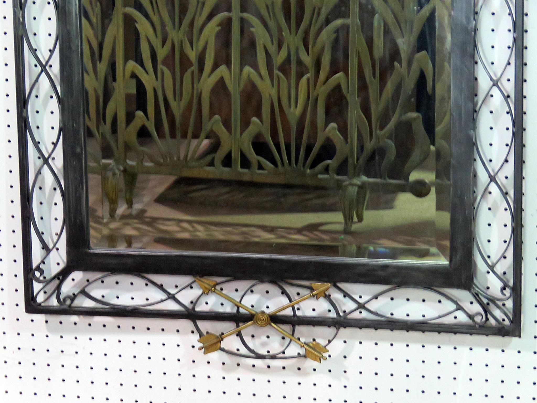Regency style metal framed wall mirror.
