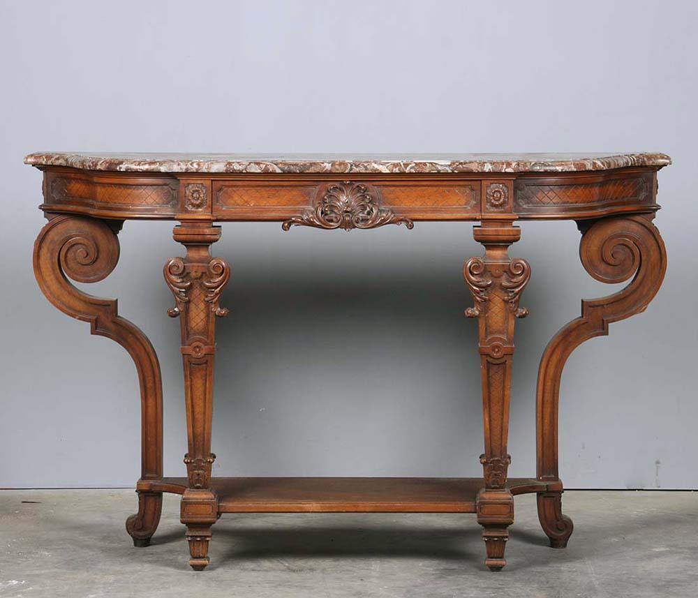 Solid walnut console table with beautiful carvings.
The table is signed by l'Hoste and Bernel, Paris. 
With a marble top, the marble type is 'Rouge de Rance'.
The table was made in France at the end of the 19th century. The style is French