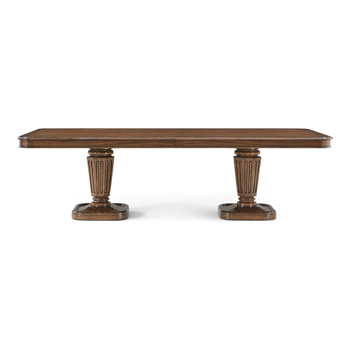 Meticulously crafted with figured walnut, this piece draws inspiration from the historic design traditions of Regency-era England. A rich and warm heirloom walnut finish enhances the natural beauty of the wood grain, while classic brass accents lend