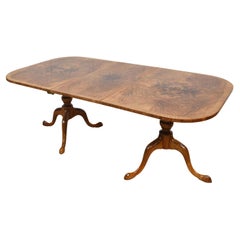 Antique Regency style walnut twin pillar dining table