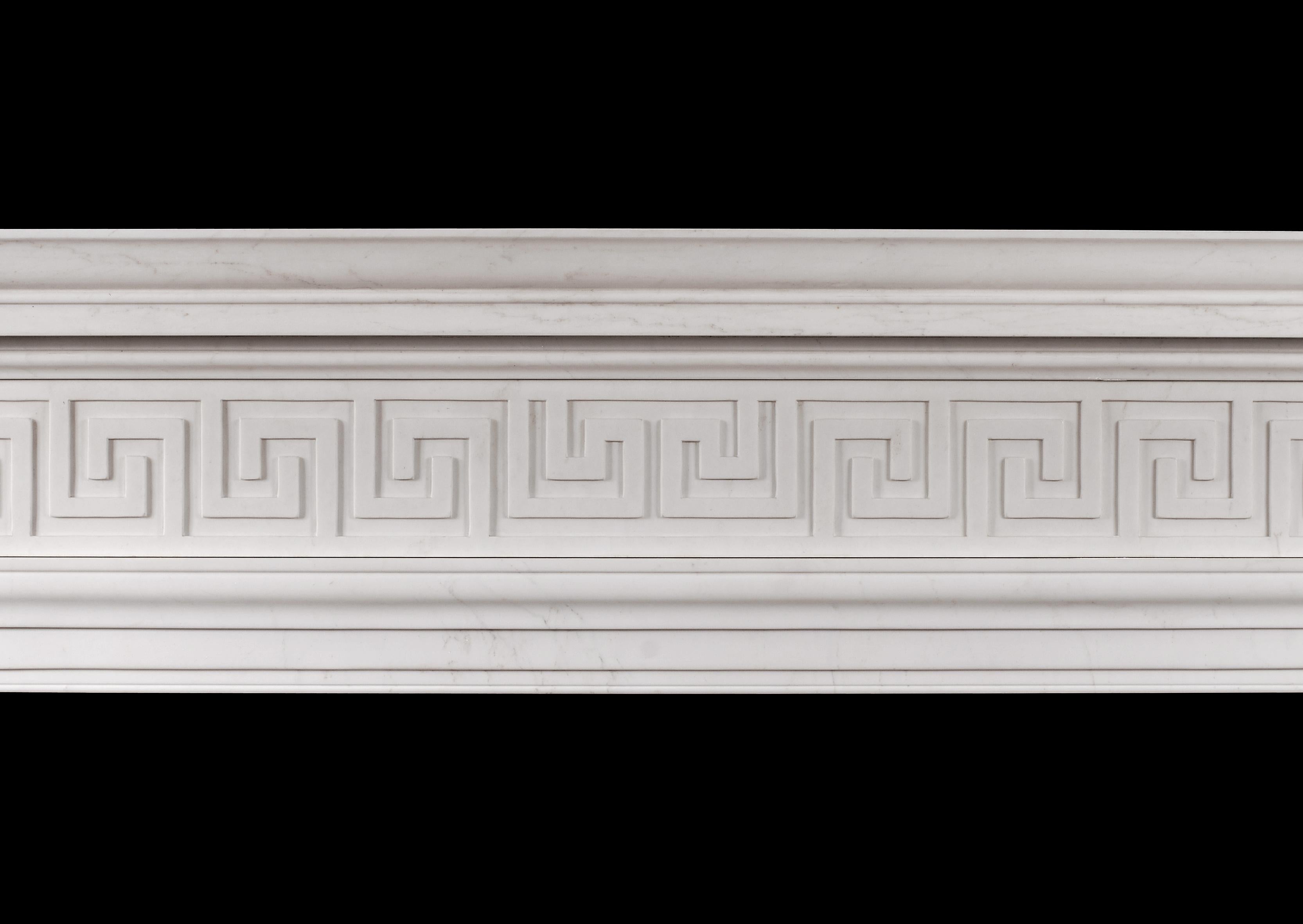 A good quality English Georgian style fireplace in white marble. The moulded shaped jambs surmounted by Greek key pattern frieze and straight moulded shelf. Copy of an early 19th century design.

Shelf Width: 1805 mm 71 ?