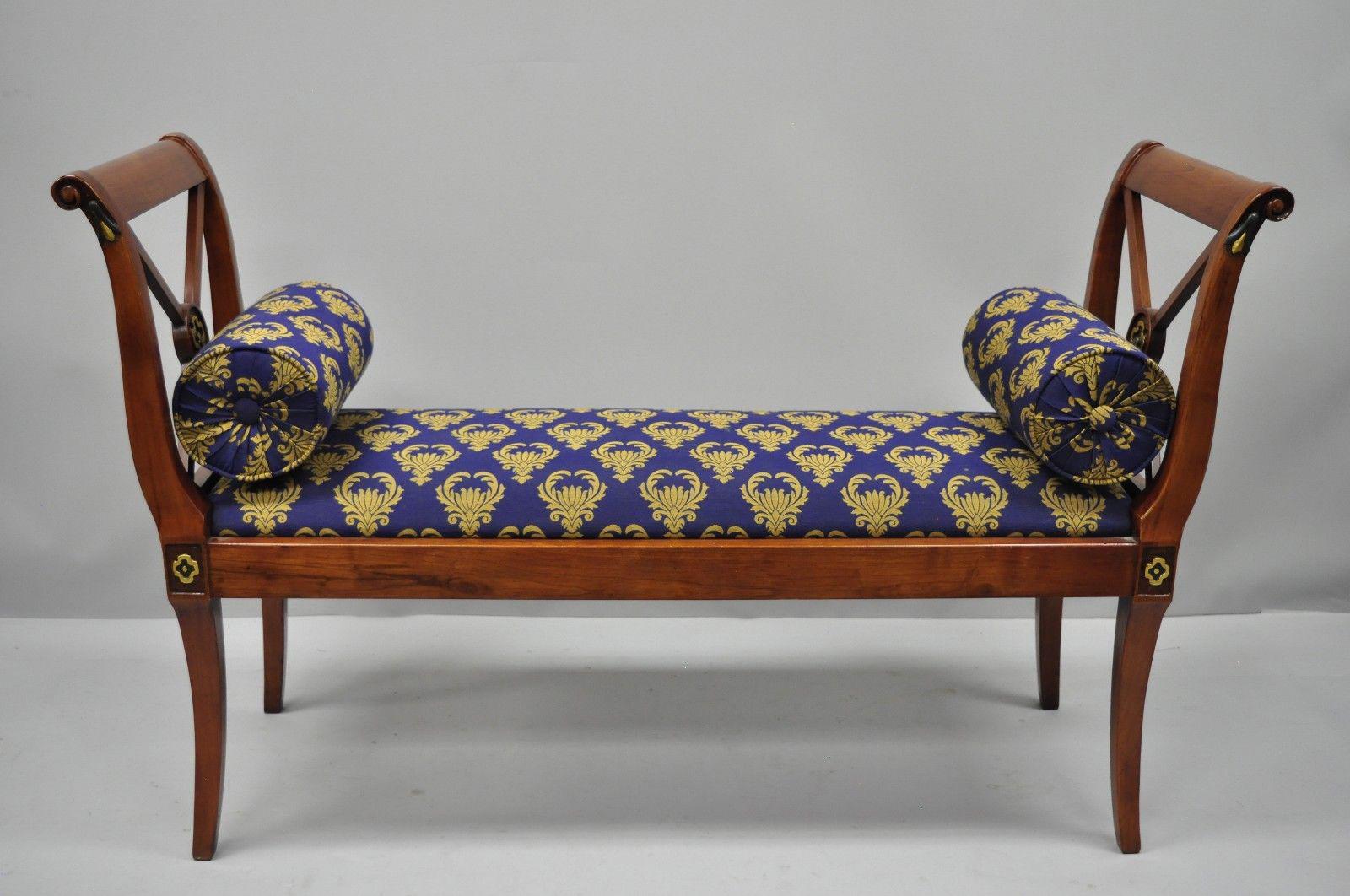 Regency style X-form bench with blue and gold fabric. Unmarked but believed to be Maitland-Smith. Acquired from an estate with lots of Maitland-Smith furniture. Item features X-form carved sides, blue and gold upholstery, painted accents, solid wood