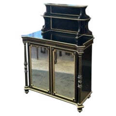 Regency style 19th Century Ebonized Mirrored Cabinet with gold gilt accents