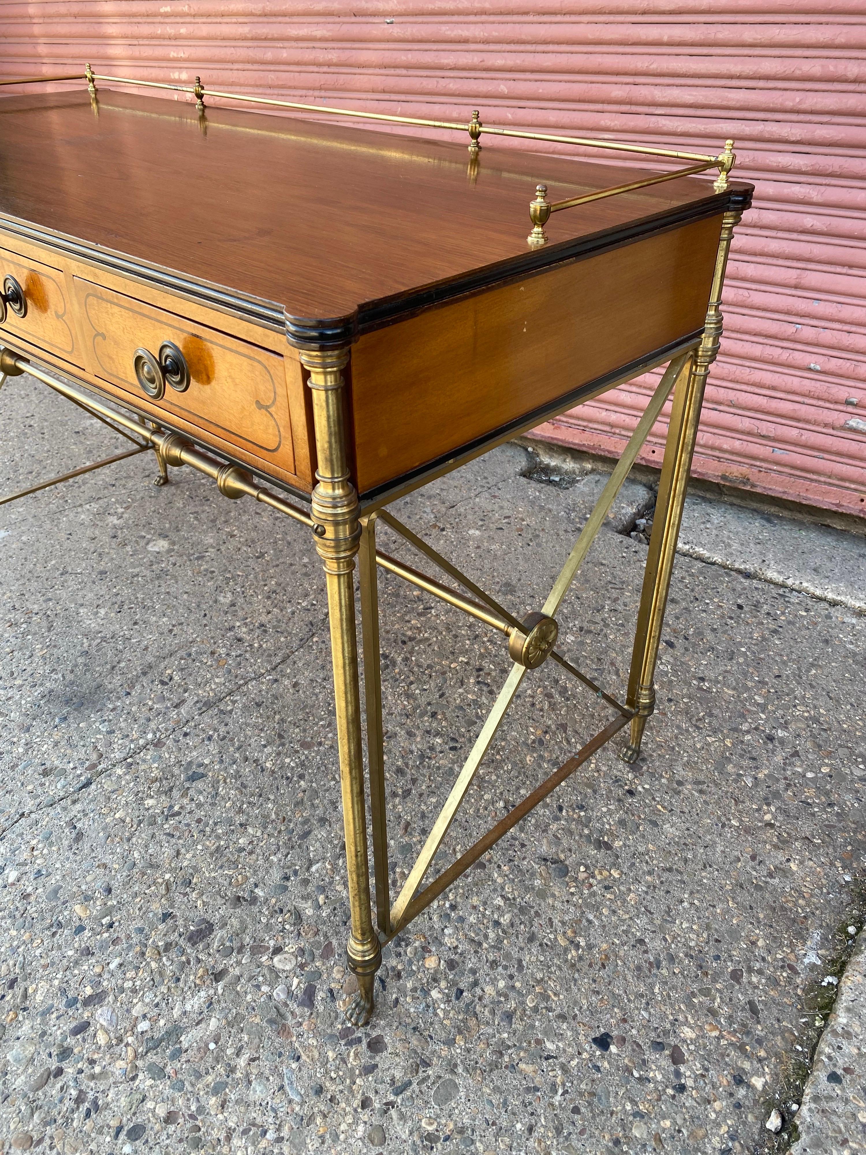 Kittinger English Regency Style Rosewood Writing Desk. Campaign Style with Bronze Legs and upper apron arond sides and back of writing surface. Perfect to use as a Console Table as well! Kittinger Stamp inside drawer. Top surface shows some wear as