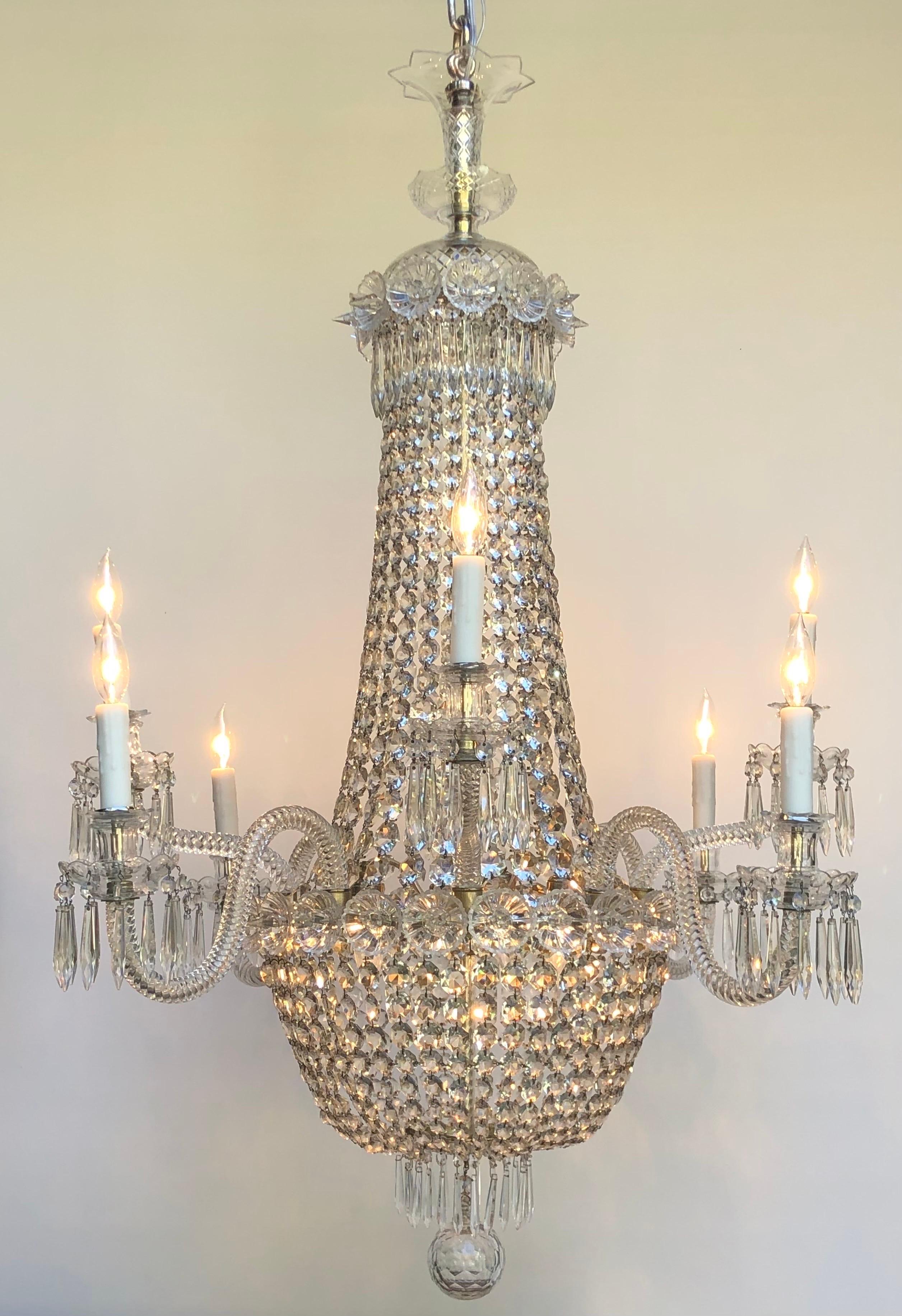 Elegant Silver Plate & Crystal Regency Tent-and-Basket Chandelier / Gasolier with Eight crystal arms, made in England in the mid Nineteenth Century. The Regency Chandelier has a three part hand-cut crystal crown with a fluted vase above the Sliver