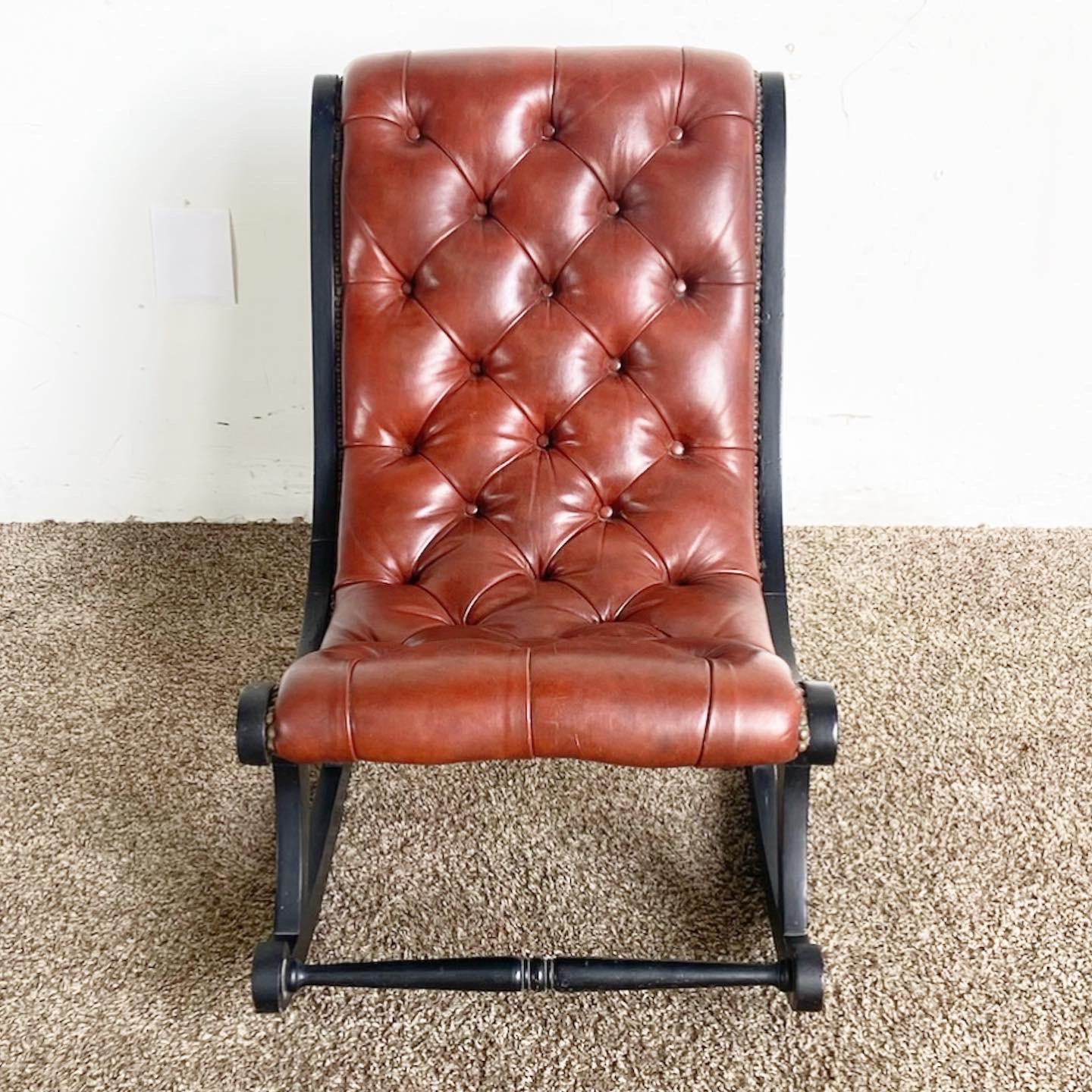 Experience timeless luxury with our Regency Tufted Leather Rocking Chair, a classic piece offering refined elegance and optimal comfort.

Features a sumptuous brown leather seat, richly tufted for an elegant and comfortable design.
Contrasting black