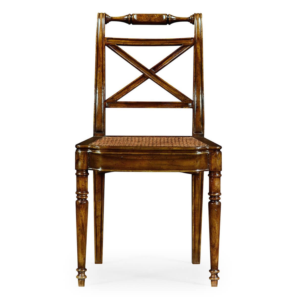 Late Regency style walnut side chair, the shaped bar top rail above an X-frame back, caned seat and paneled break fronted rail and turned straight legs. A Classic design of the early 19th century.

Dimensions: 20.5