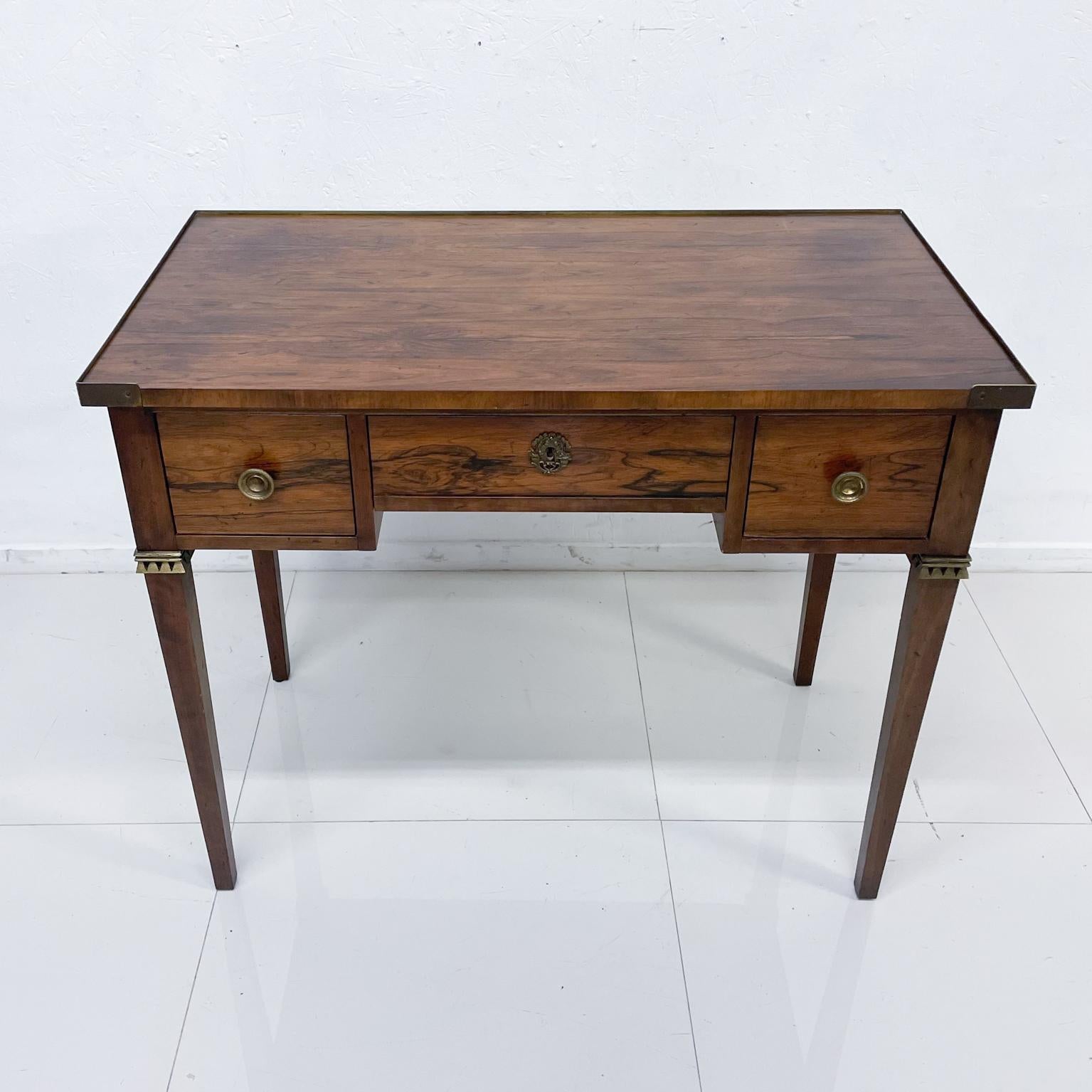 For your consideration: Elegant Regency finely crafted small writing desk in rosewood and bronze.
Entry receiving table. Key included for desk.
Retains Label BAKER in top drawer. Designed by Michael Taylor for Baker Furniture
Measures: 19 D x 36 W x