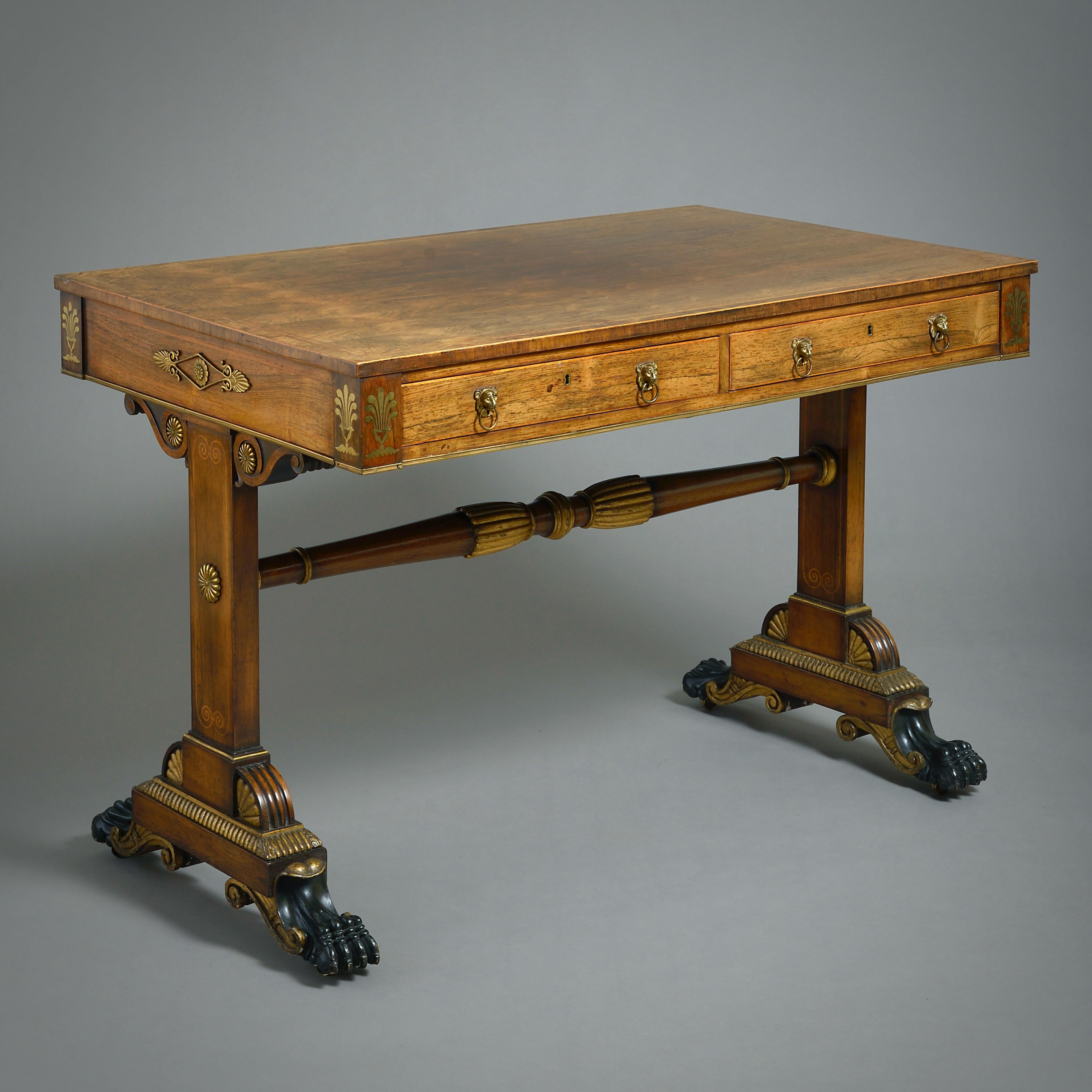 A FINE REGENCY ORMOLU-MOUNTED, BRASS-INLAID AND PARCEL-GILT WRITING TABLE, CIRCA 1810.

The frieze filled with two mahogany lined drawers. All mounts and handles original.