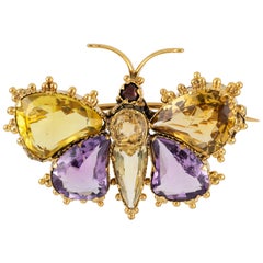 Broche papillon en or jaune et pierres précieuses de style Régence