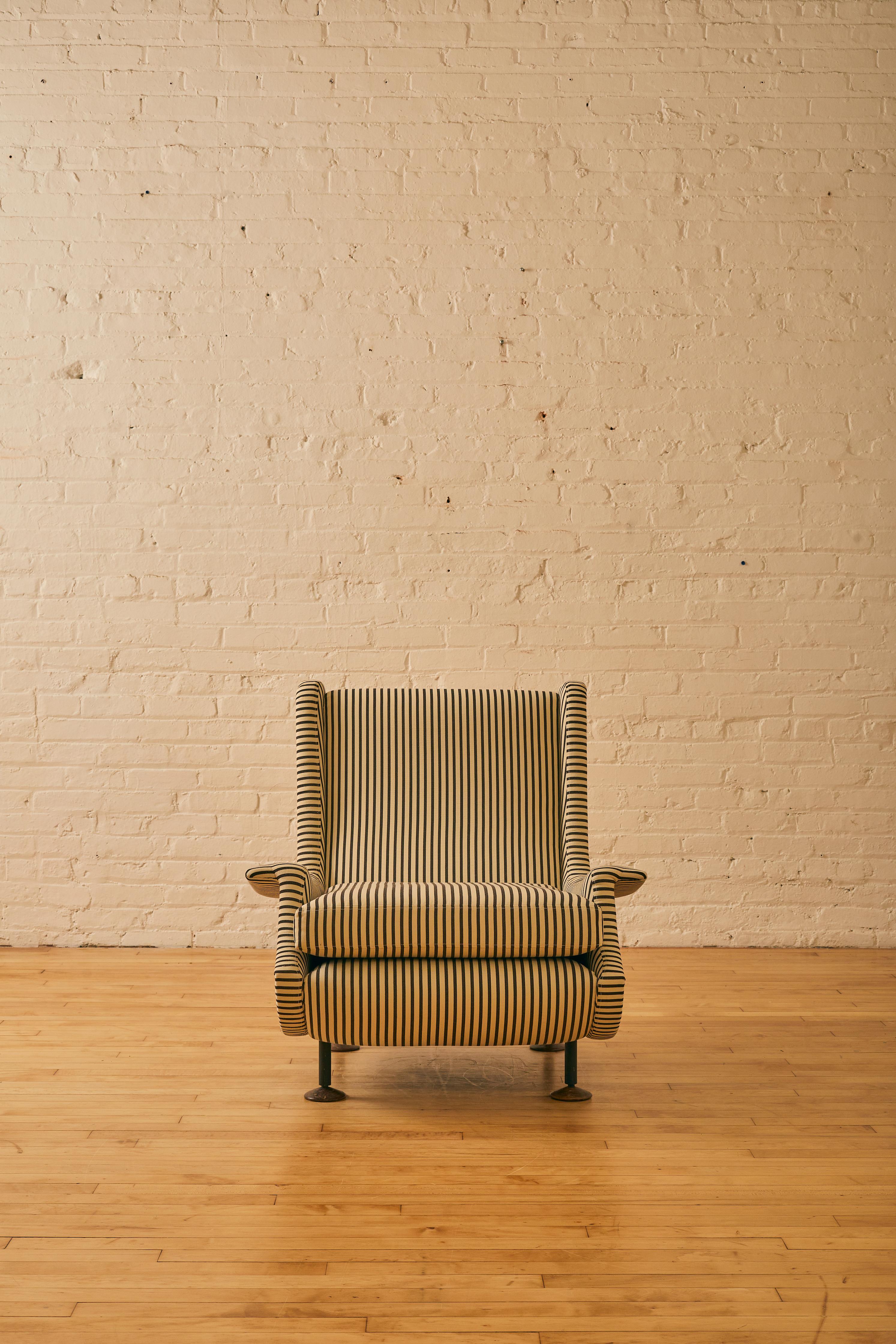 Regent Armchair by Marco Zanuso reupholstered with Dedar Milano's Strange Loves indoor/outdoor cotton twill stripe.