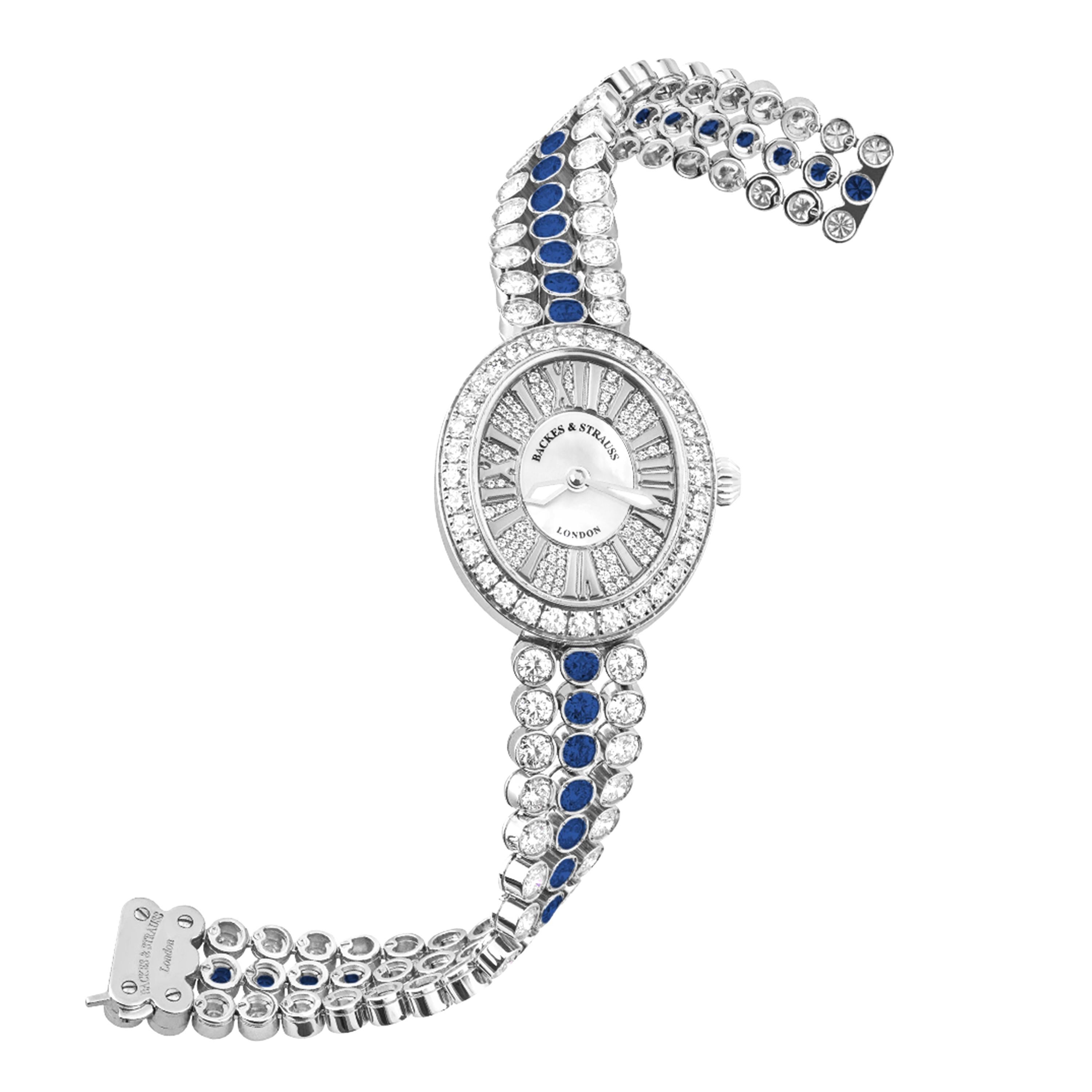 Regent Duchess Blue Velvet 2833 is a luxury diamond watch for women crafted in 18kt White gold, featuring the mother-of-pearl oval dial with the white gold roman numerals, quartz movement. The case, dial and the crown are set with white Ideal Cut