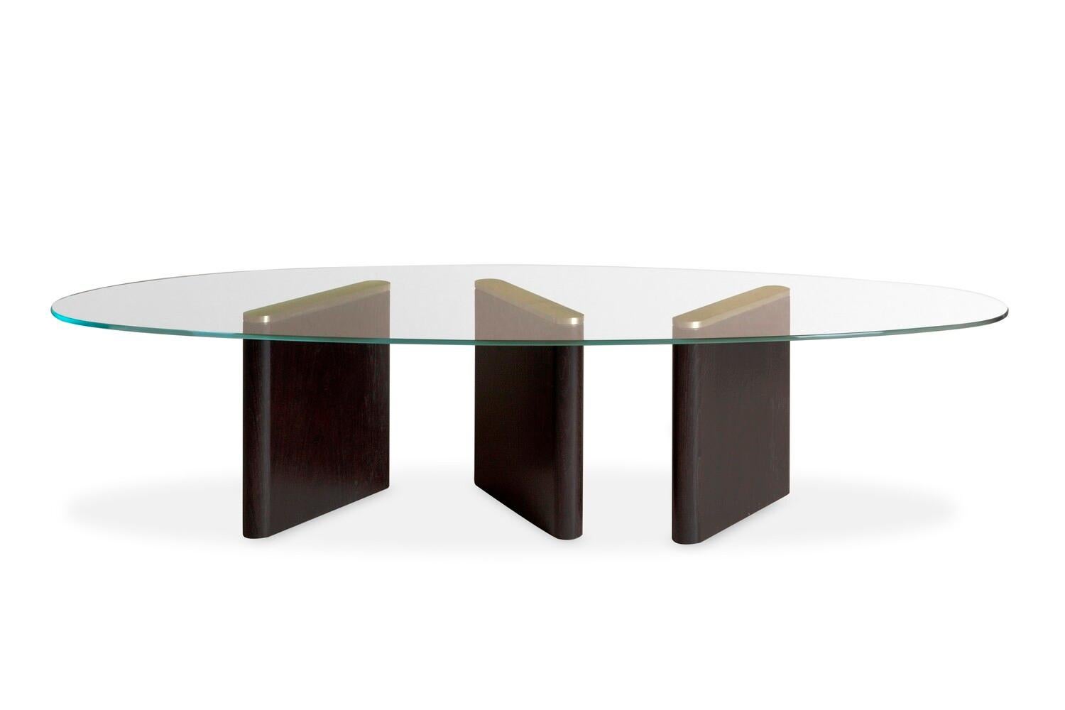 The Regent coffee table has a striking, asymmetrical 8mm glass top. Its angled legs, crafted in oak with glamorous brushed brass accents, are on full show beneath. The result is a pared-back, contemporary design, which works beautifully both alone,