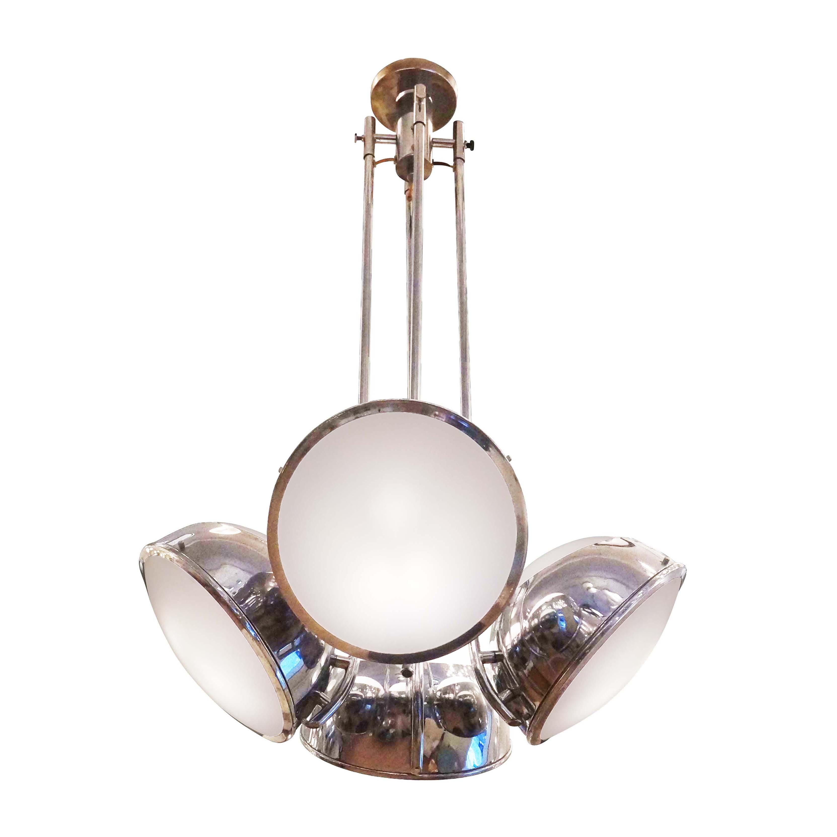 1960’s polished nickel chandelier by Reggiani. Four lights, each with two frosted glass diffusers.

Condition: Good vintage condition, minor wear consistent with age and use.

Diameter: 24”

Height: 42”

Ref#: LTZ2039