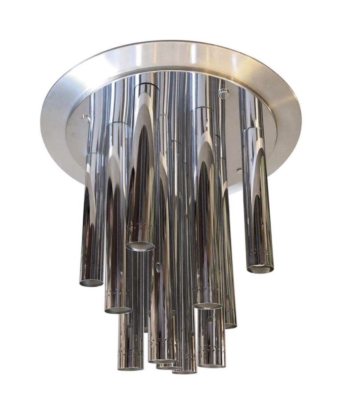 This Space Age steel and chrome Italian chandelier can be used also as a table lamp. It works 110-240 Volts and need 13 regular e27 bulbs.