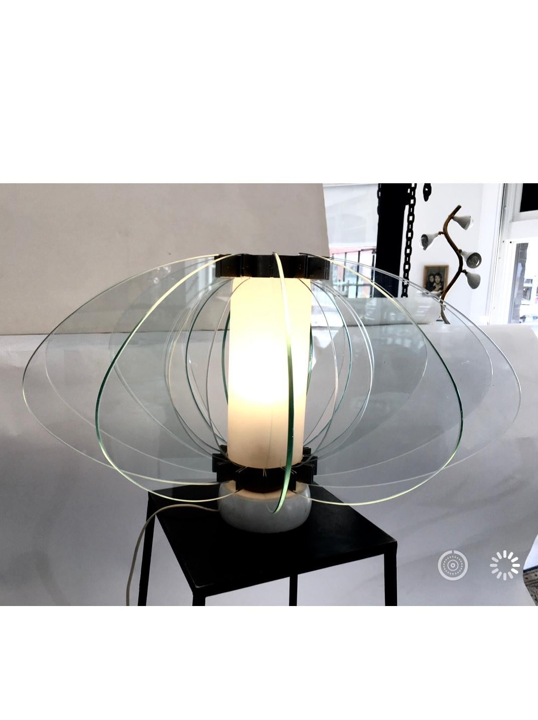 Beautiful table lamp by Reggiani, with 6 inch round marble base and 1/4 inch thick glass. Italy, 1960s.
