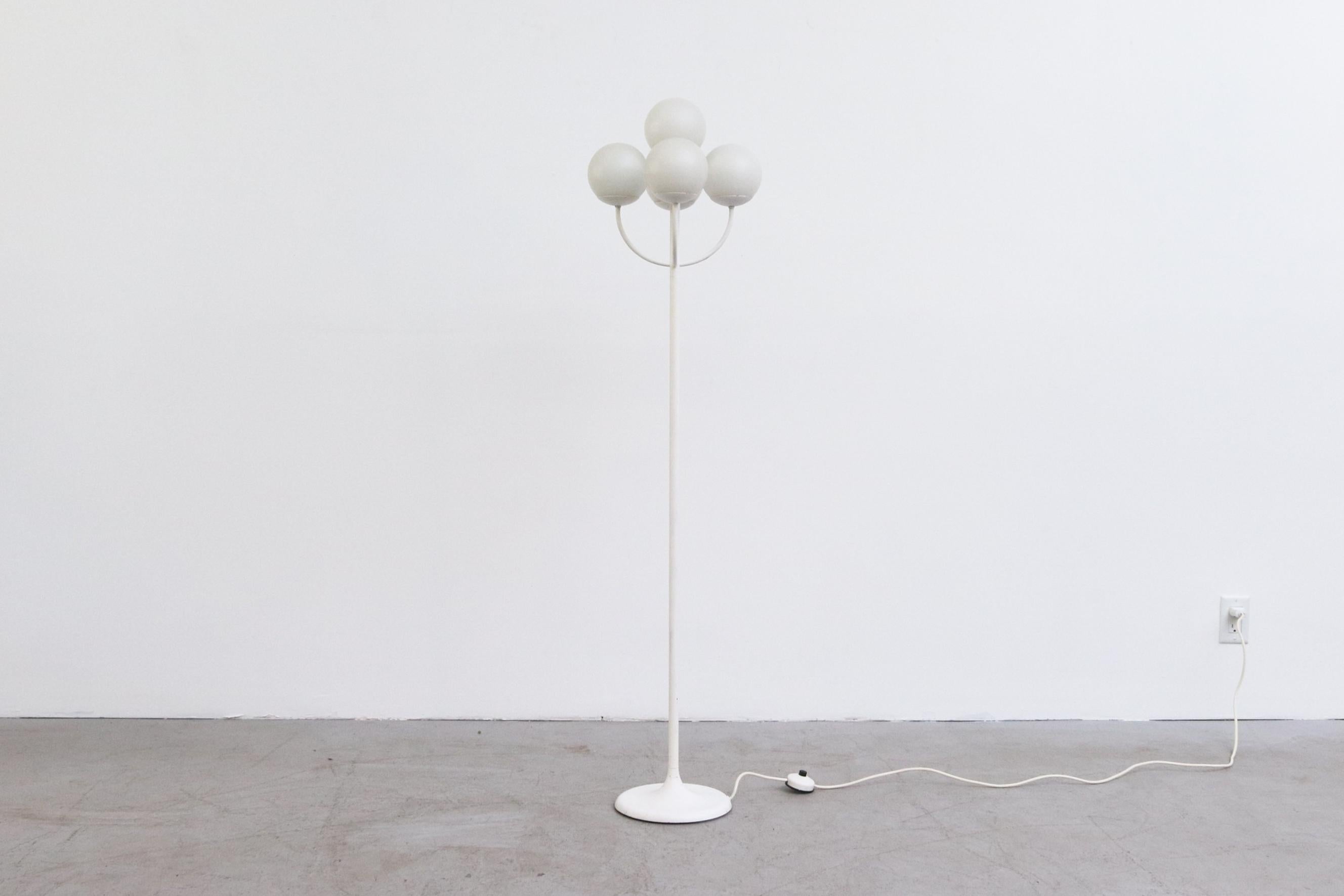 Impressive Reggiani inspired white enameled floor lamp with tulip base and a cluster of 5 European candelabra sockets with matte milk glass globes. They will require bulb (EU to US) adapters or European 110v candelabra bulbs. May have originally